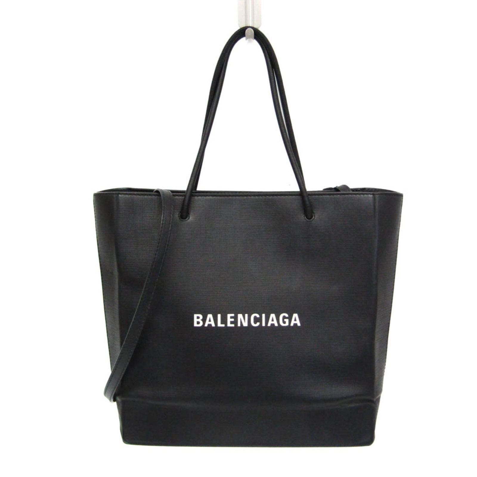 Shoulder Bag Leather Tote Bag By Balenciaga: Shoulder Bag Leather Tote Bag By Balenciaga Black leather shoulder bag by Balenciaga, featuring a magnet closure and zipper pocket. The bag boasts a spacious interior with an open pocket and has a