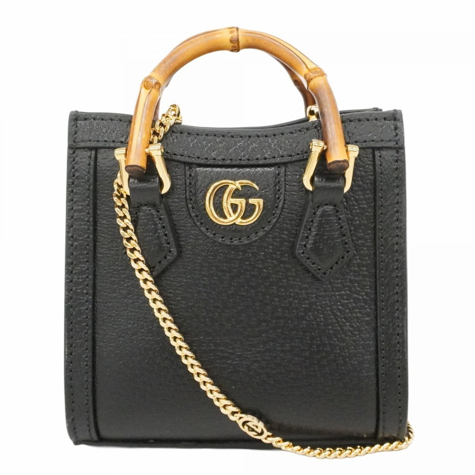 Handbag Leather Gucci: Handbag Leather Gucci This black Gucci leather handbag features gold hardware, with a compact size and sturdy construction. The bag has been used and shows some signs of wear, including scratches and