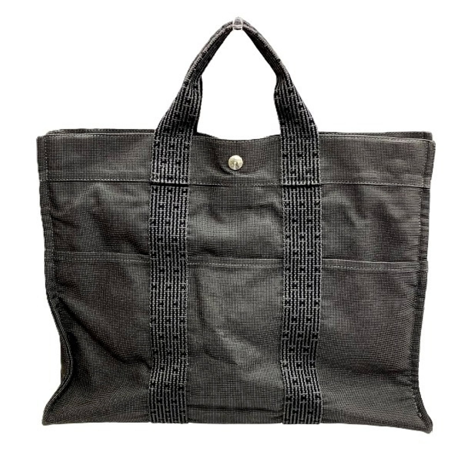 Canvas tote bag by Hermes: Canvas tote bag by Hermes Canvas tote bag by Hermes, measuring 33cm x 43cm x 10cm with a sturdy handle length of 28cm. This canvas tote bag bears the signature of its creator and features subtle signs