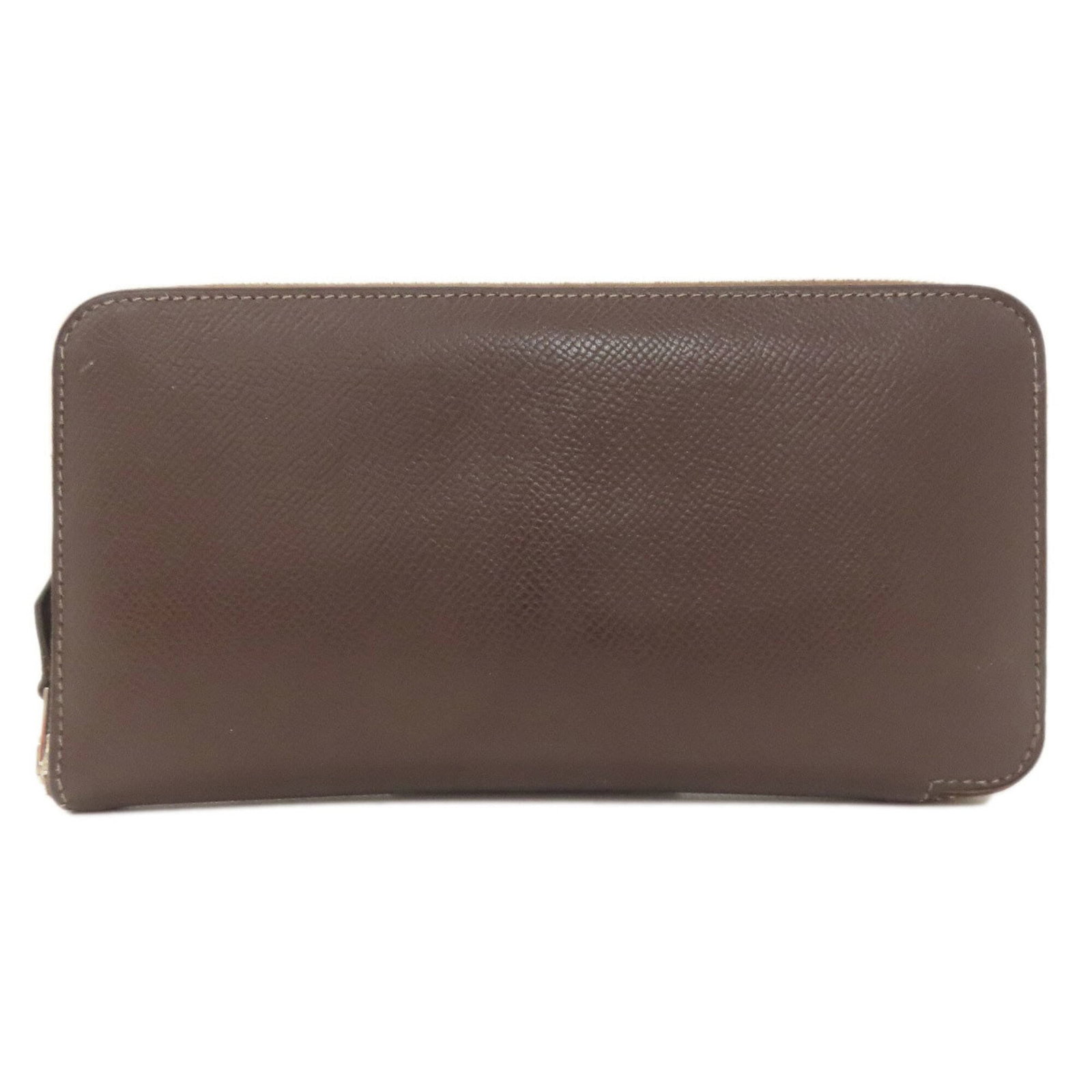 Epsom long bi-fold leather wallet from Hermes: Epsom long bi-fold leather wallet from Hermes Dark Brown Epsom Leather Bi-Fold Wallet from Hermes. This long bi-fold wallet features high-quality Epsom leather in dark brown, with a classic zipper
