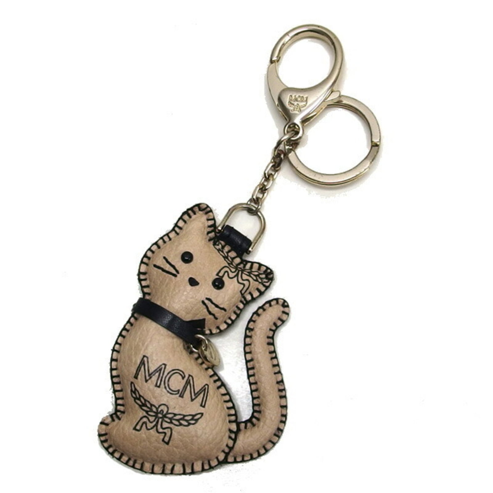 Keyring Leather Metal Mcm: Keyring Leather Metal Mcm Leather and metal come together in a chic keyring design, featuring a subtle charm with a champagne gold finish. Made from high-quality materials, this versatile accessory
