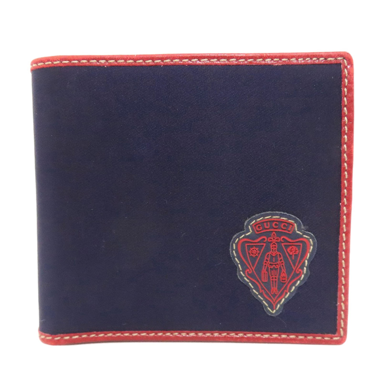 Nylon Bi Fold Wallet: Nylon Bi Fold Wallet Nylon bi-fold wallet from Gucci, featuring a classic design with a navy color. The wallet measures 9.5cm x 10.5cm x 1.5cm and shows signs of use, including scratches and dirt. Use
