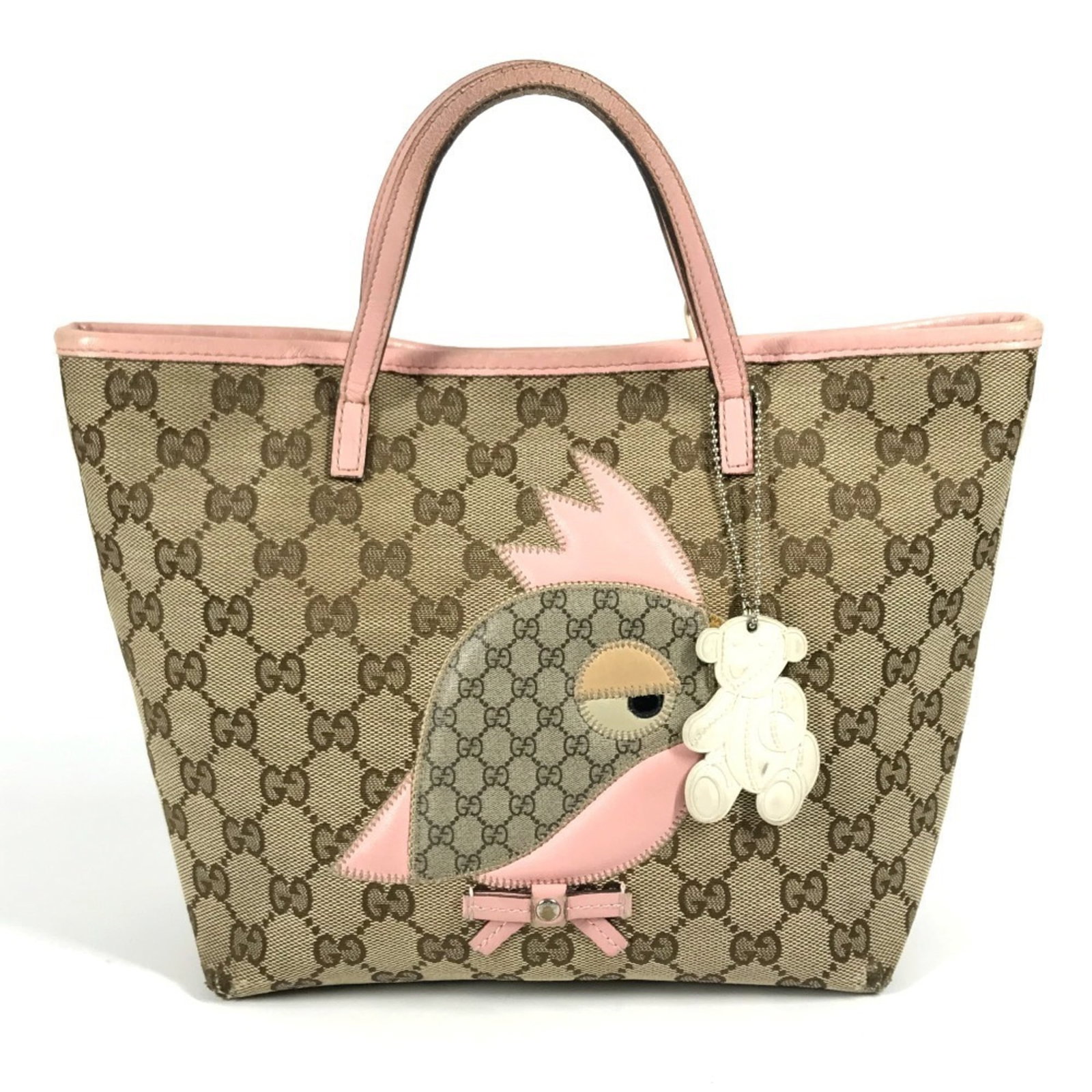 Canvas leather tote bag handbag Gucci: Canvas leather tote bag handbag Gucci Gucci canvas leather tote bag in beige and pink, featuring a classic design with a signature Gucci touch. This pre-owned tote bag has been well-loved, with