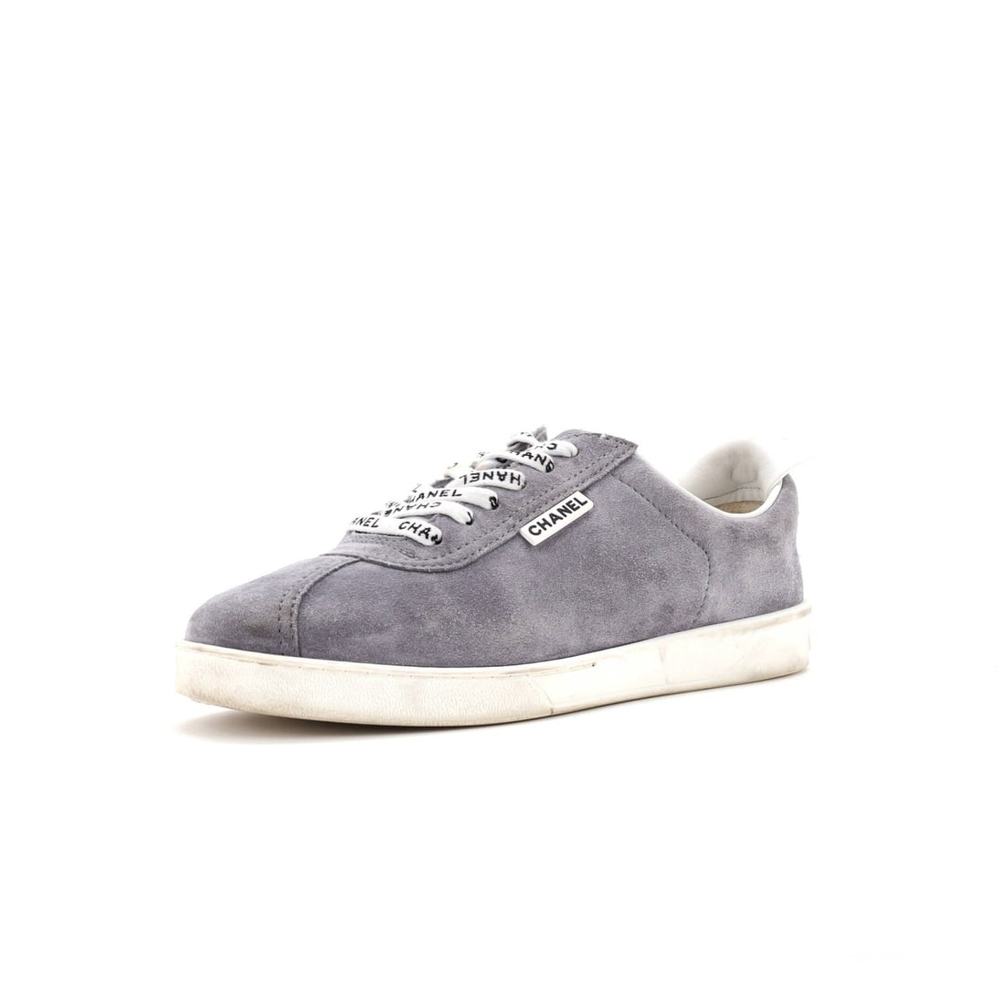 Women's Low Top Sneakers Suede Flat CC Chanel: Women's Low Top Sneakers Suede Flat CC Chanel Gray Suede CC Chanel Low-Top Sneakers with White Leather Interior, featuring a classic flat design and suede exterior. The shoes show signs of wear,