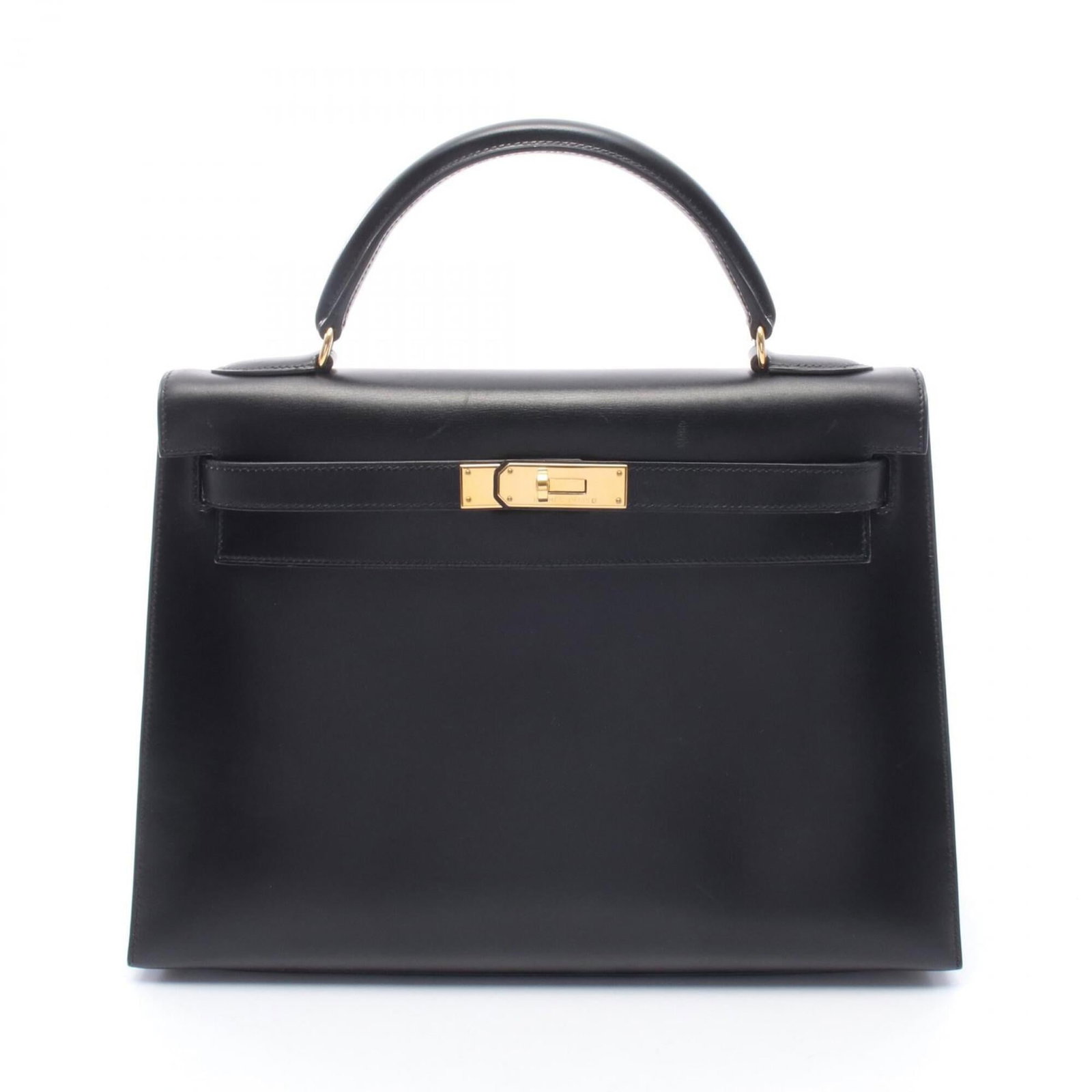 Calf leather box handbag Hermes: Calf leather box handbag Hermes Box Calf Leather Handbag in Black, A Timeless Classic. This pre-owned Hermes handbag features box calf leather construction and a sleek black finish, measuring 23cm x