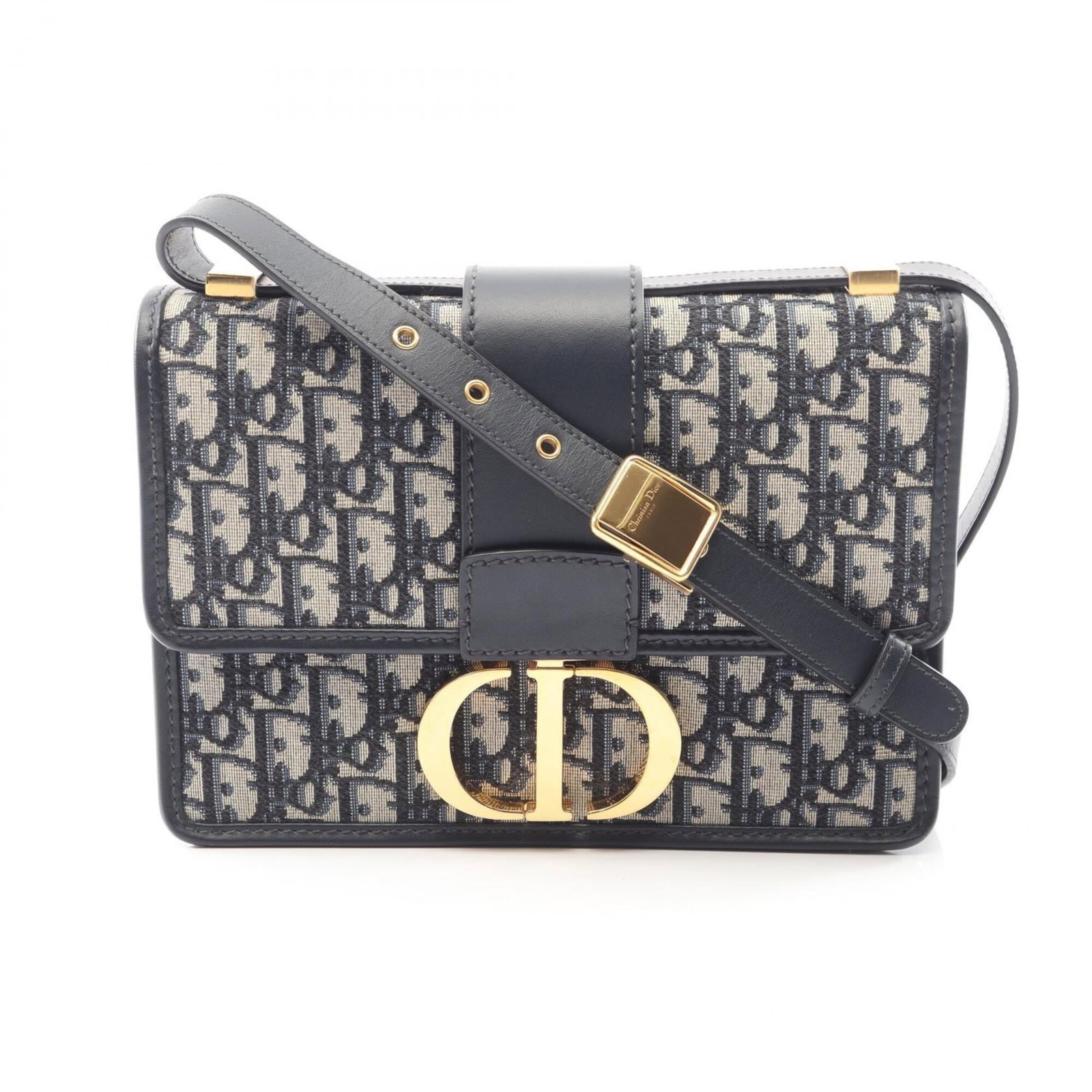 Canvas leather shoulder bag by Christian Dior handbag: Canvas leather shoulder bag by Christian Dior handbag Canvas leather shoulder bag by Christian Dior, featuring a classic design with beige and navy hues. This pre-owned handbag boasts a canvas and