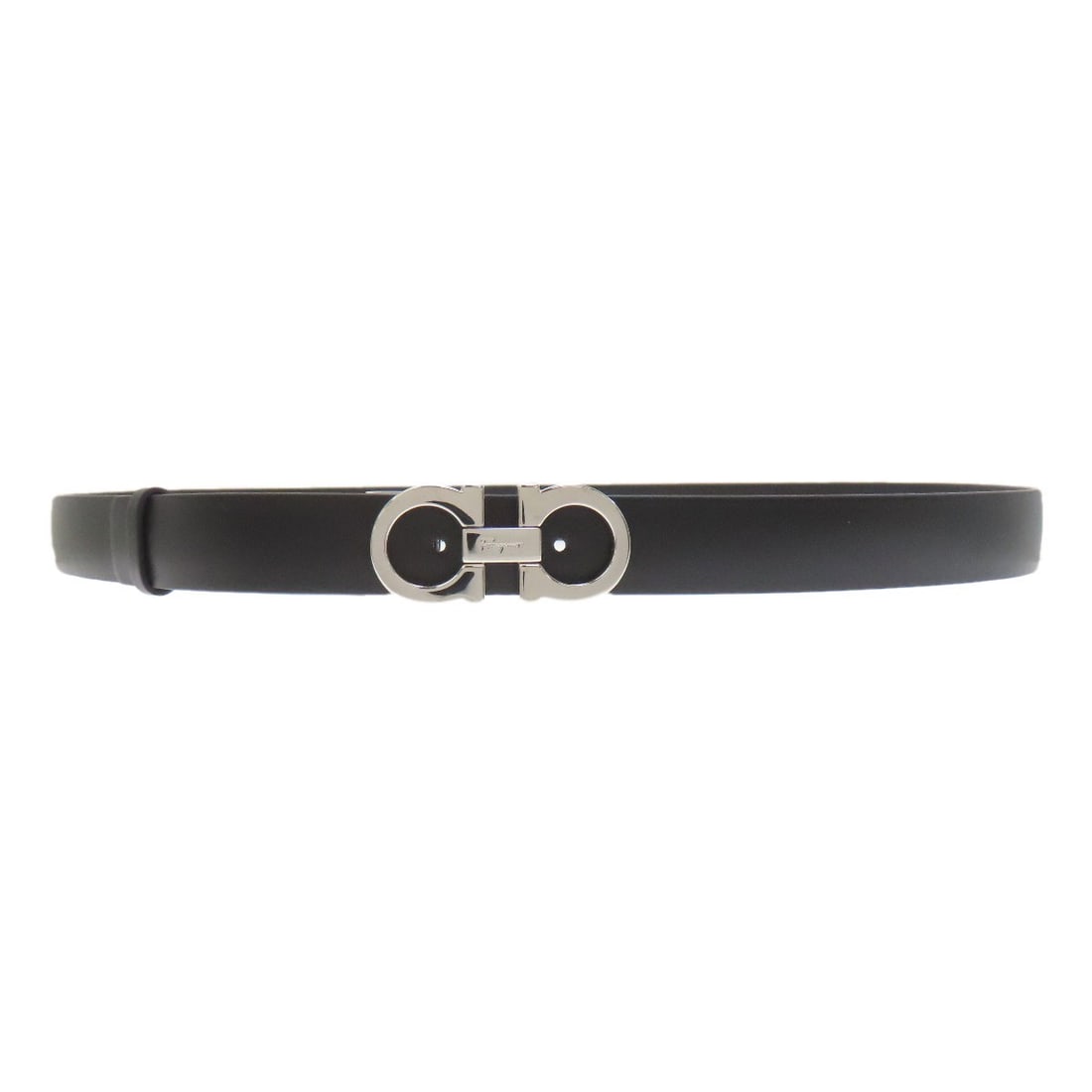 Salvatore Ferragamo Gancinihardware Belt Leather: Salvatore Ferragamo Gancinihardware Belt Leather Black leather belt from Salvatore Ferragamo's Gancini collection, featuring the iconic hardware design. This classic accessory showcases sleek black