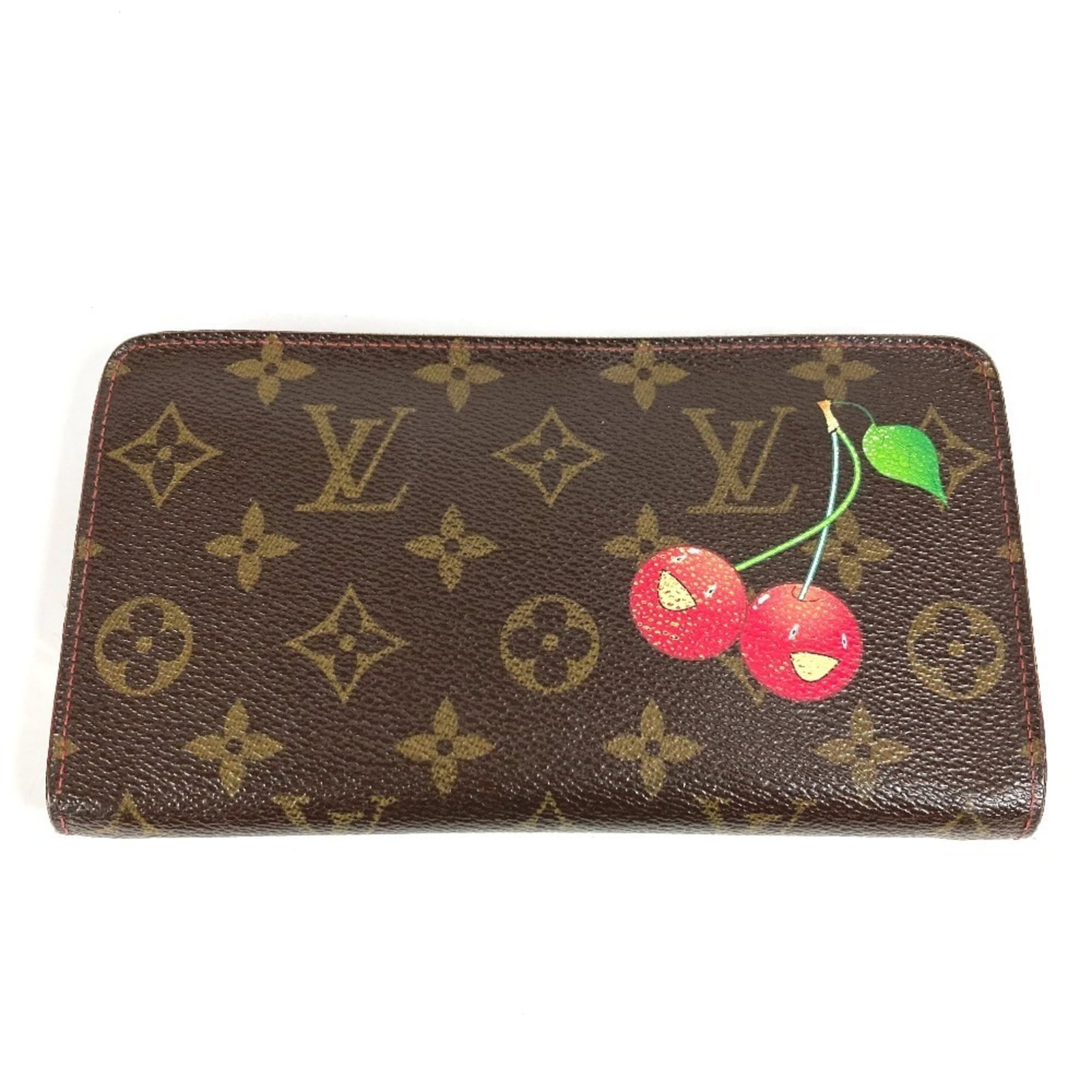 Louis Vuitton Monogram Bi fold Wallet: Louis Vuitton Monogram Bi fold Wallet The Louis Vuitton Monogram Bi fold Wallet features the iconic monogram pattern in brown, cherry, and red hues. This long wallet measures 10cm x 19cm and has a