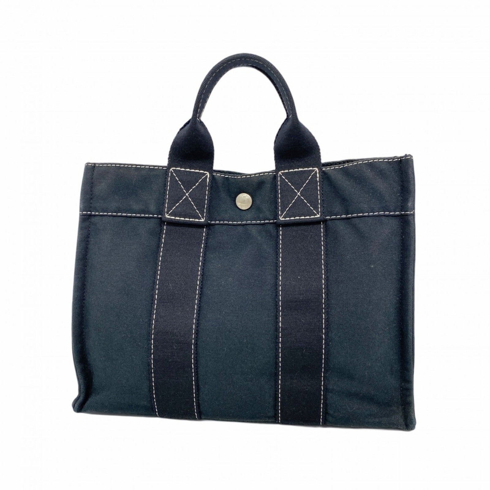 Handbag from Hermes: Handbag from Hermes Black canvas handbag from Hermes with silver hardware, measuring 23cm x 30cm x 8cm. The bag bears traces of usage and shows minor scratches and dirt, but remains in good condition