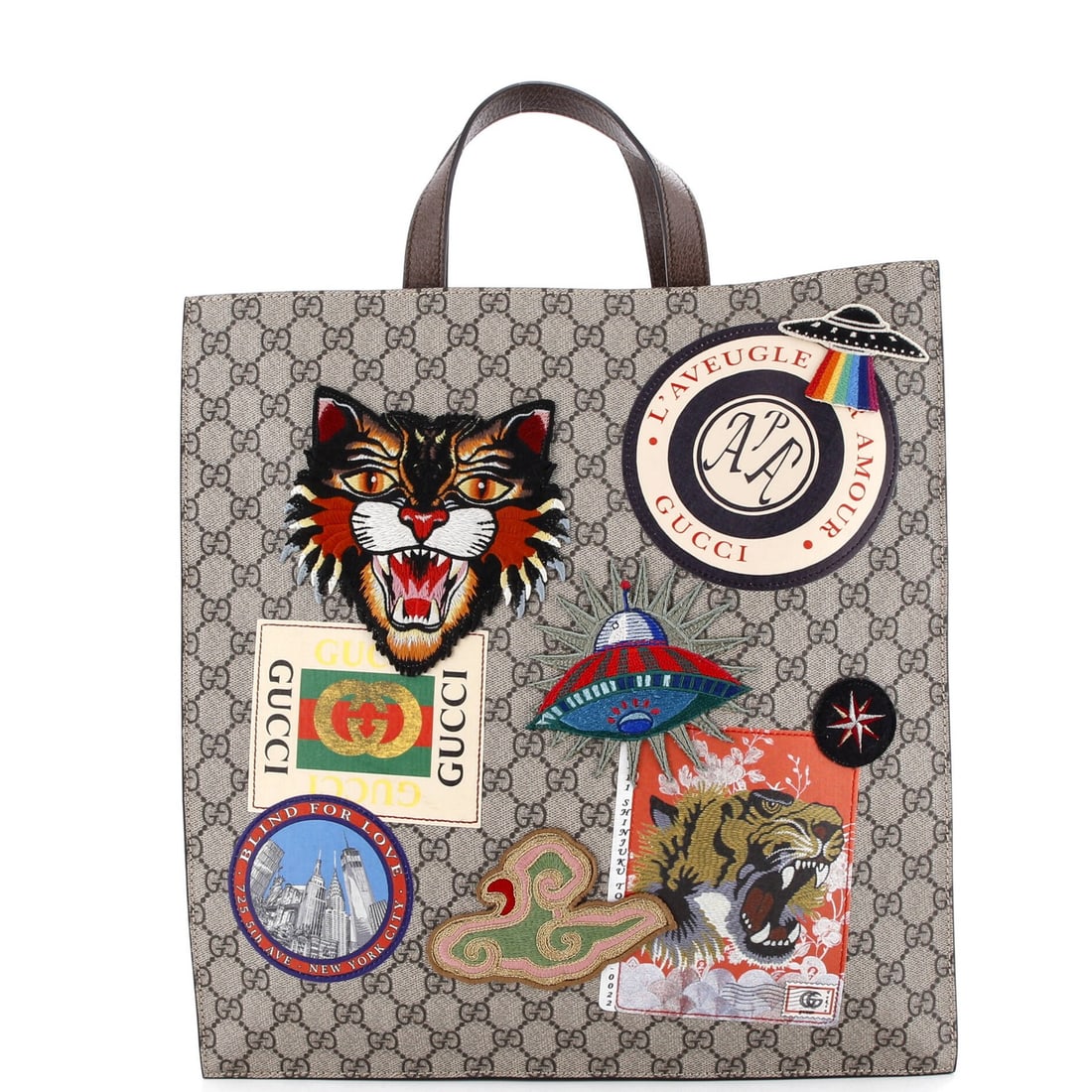 Gucci Courrier Convertible Soft Open Tote GG Coated Canvas with Applique North: Gucci Courrier Convertible Soft Open Tote GG Coated Canvas with Applique North Brown canvas coated tote bag with applique north, measuring 15" tall and 14" wide, features a soft open convertible desig
