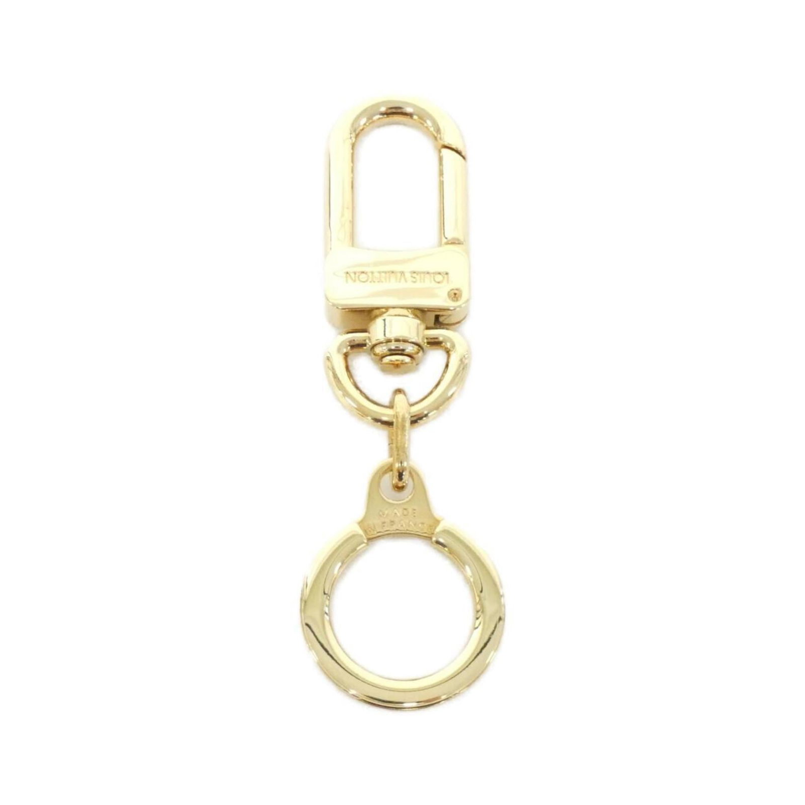 Keyring from Louis Vuitton: Keyring from Louis Vuitton Gold Louis Vuitton keyring in very good condition, bearing some minor scratches and dirt. A few traces of usage can be seen, but overall the item remains in excellent shape.