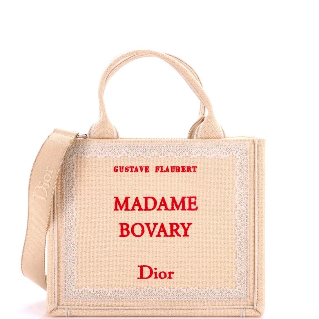Canvas tote book with strap small embroidered by Dior Christian: Canvas tote book with strap small embroidered by Dior Christian Small embroidered canvas book tote with strap, bearing the signature of Dior Christian. This neutral-toned, small-sized tote features