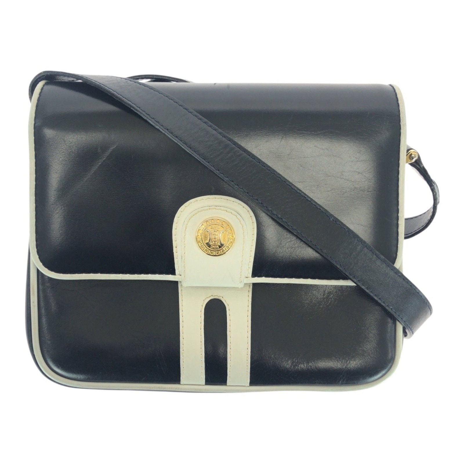 Celine Leather Pochette Bag: Celine Leather Pochette Bag Navy and white leather Celine pochette bag with scratches and dirt, showing signs of usage. Made from high-quality leather, this shoulder bag measures 15cm x 19cm x 7cm.