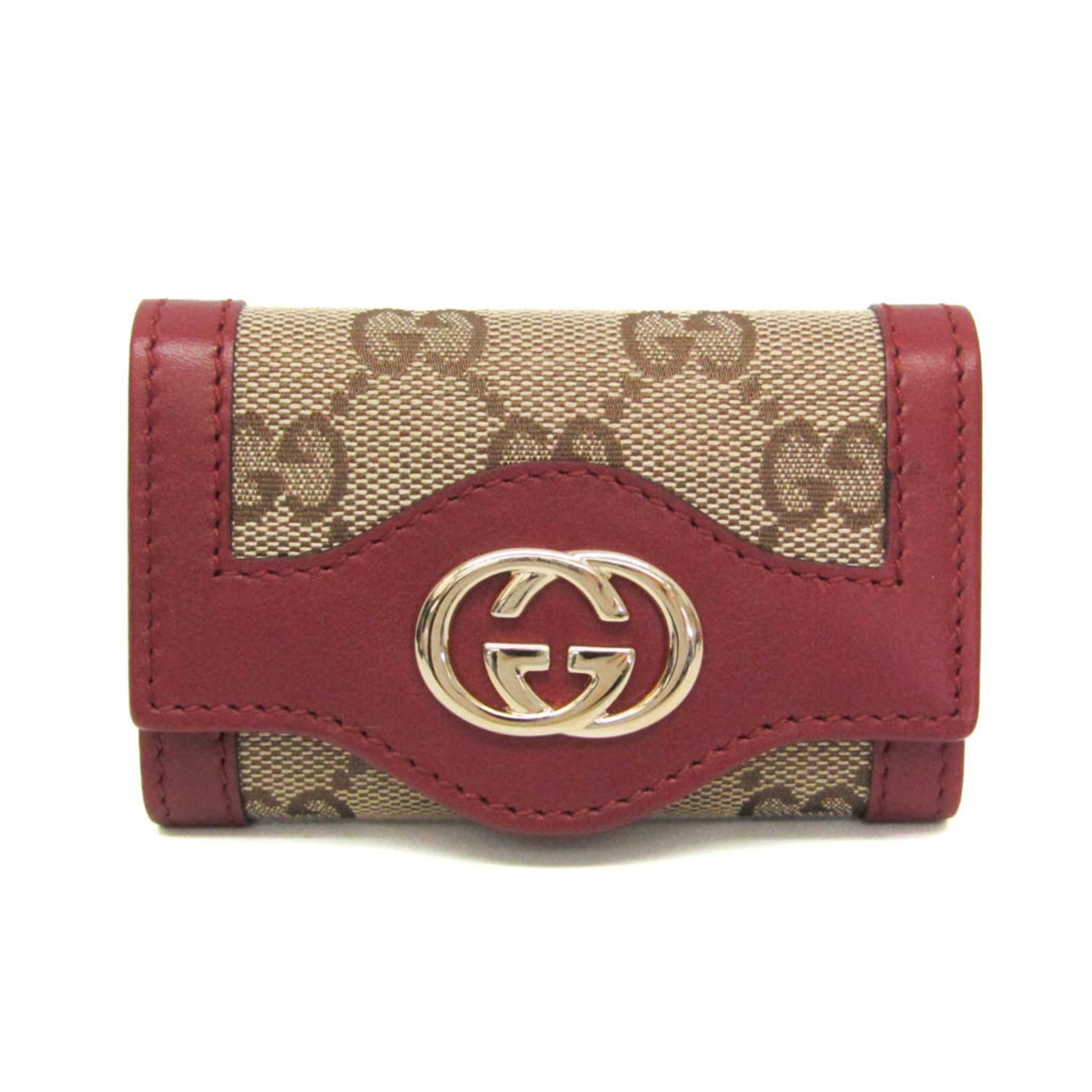 Keycase leather canvas Gucci: Keycase leather canvas Gucci Keycase leather canvas Gucci in beige and red brown, featuring 6 key hooks and an open pocket. Made from Gg Canvas and high-quality leather, this used item has hardly any