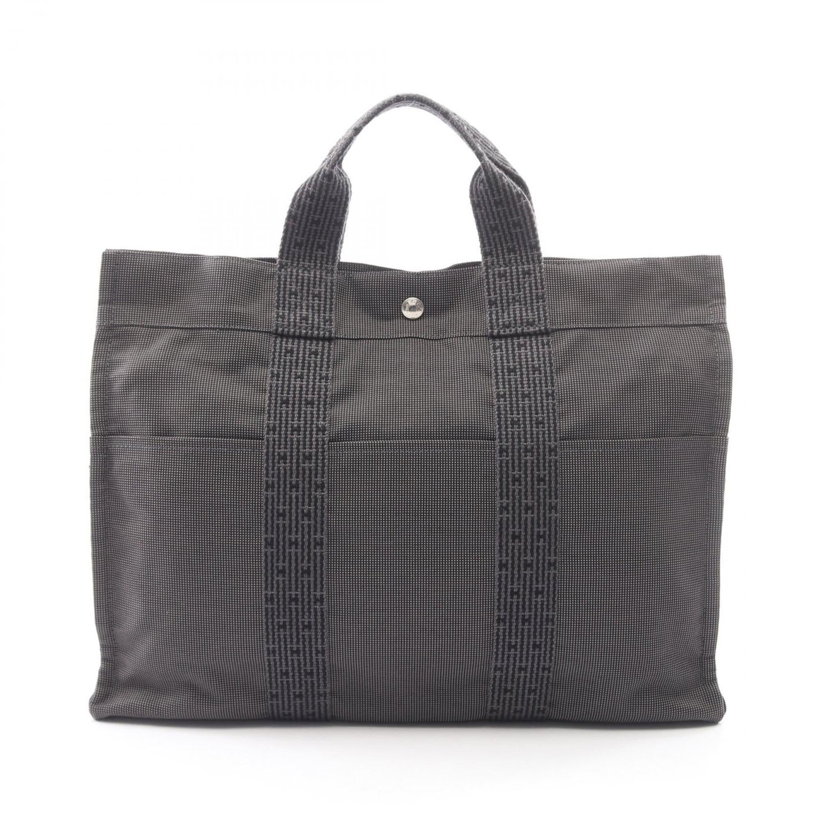 Canvas Nylon Handbag Tote Bag Hermes: Canvas Nylon Handbag Tote Bag Hermes Canvas Nylon Handbag Tote Bag from Hermes in Gray. This versatile tote bag features canvas and nylon construction, with silver hardware adding a touch of