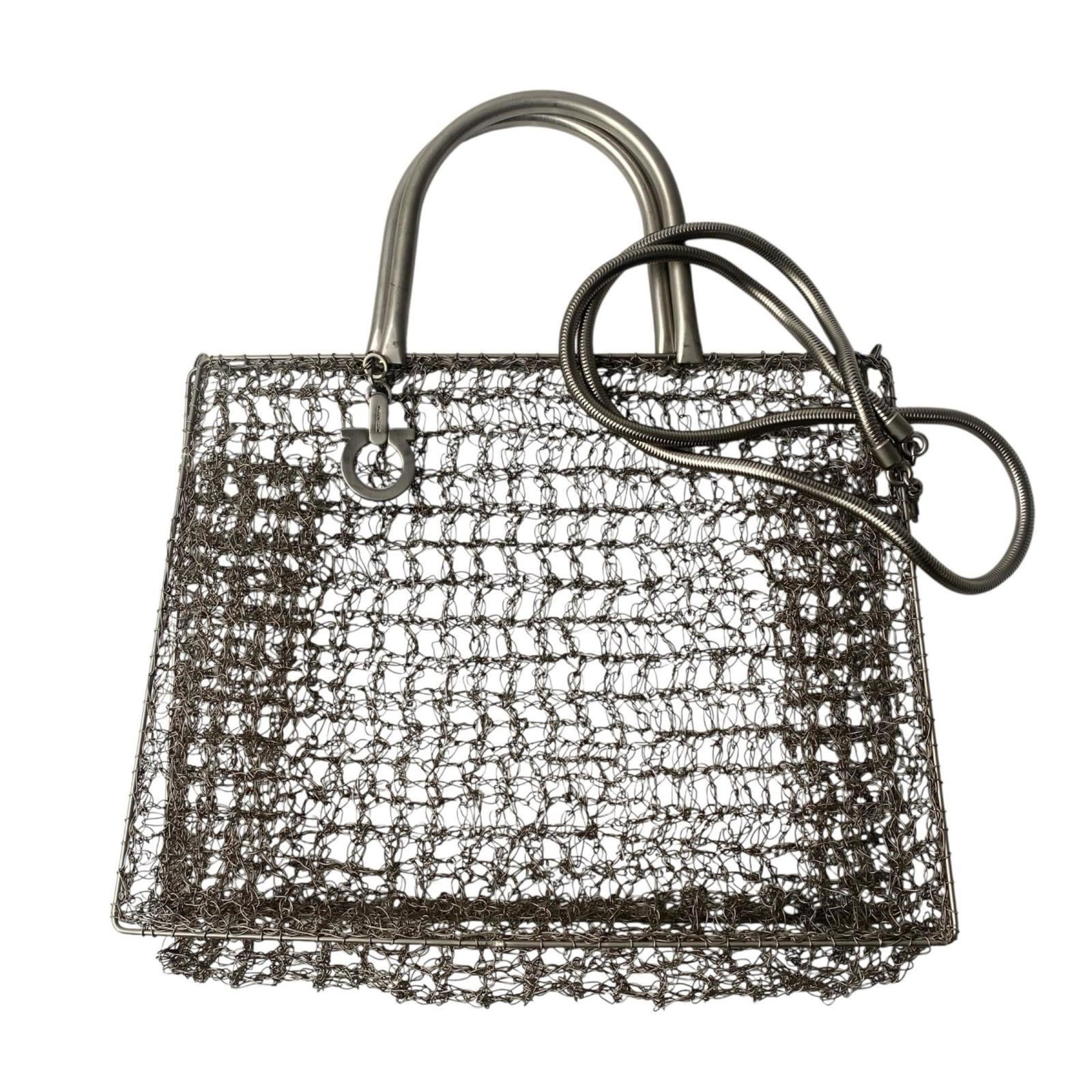 Salvatore Ferragamo Handbag Stainless Steel Shoulder: Salvatore Ferragamo Handbag Stainless Steel Shoulder Silver stainless steel shoulder bag from Salvatore Ferragamo, with a sleek and modern design. Measuring 21cm x 26cm x 7.5cm, it features a few