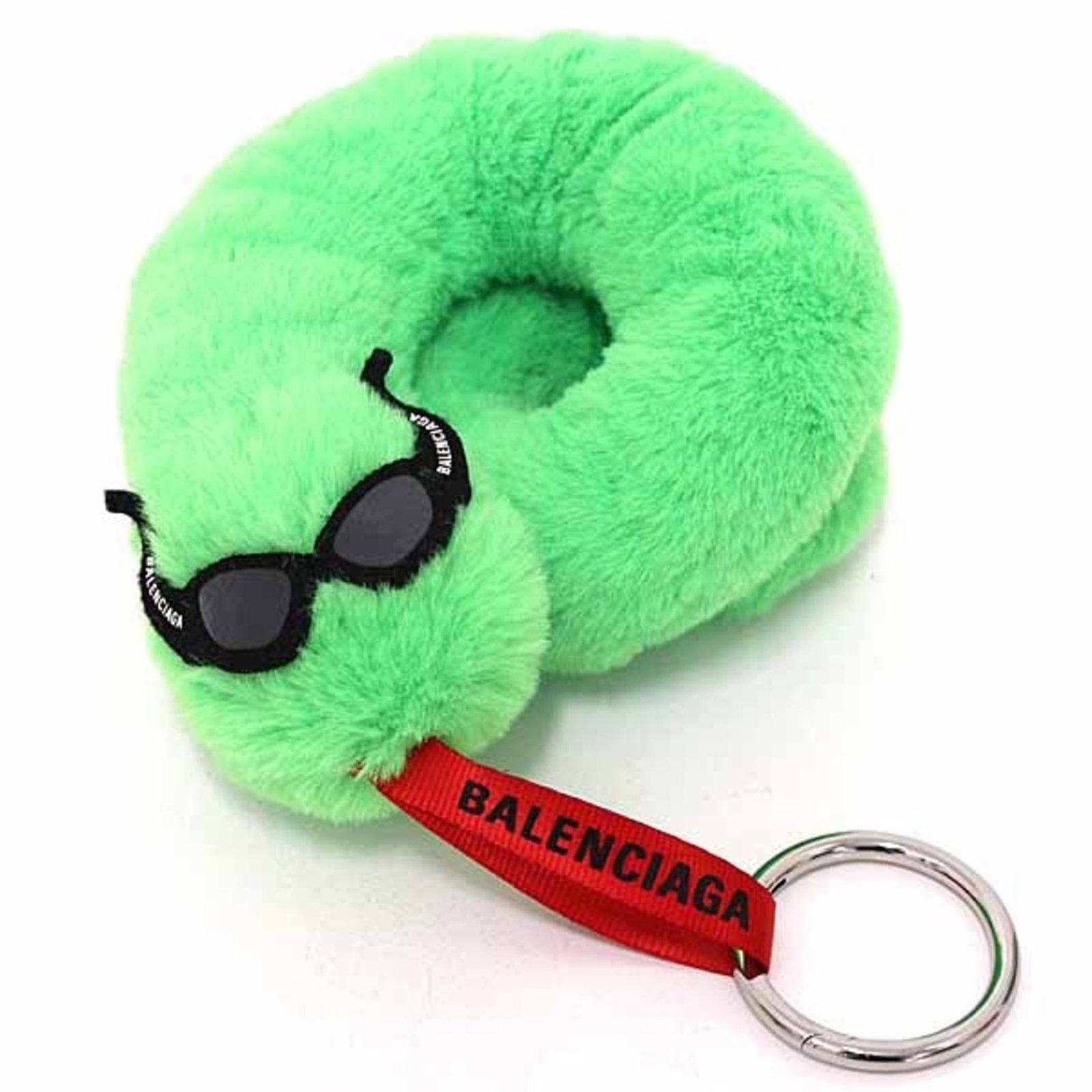 Balenciaga Keyring: Balenciaga Keyring The Balenciaga Keyring boasts a vibrant green hue, making it a striking accessory for everyday use. In mint condition and like new, this keyring showcases the brand's signature