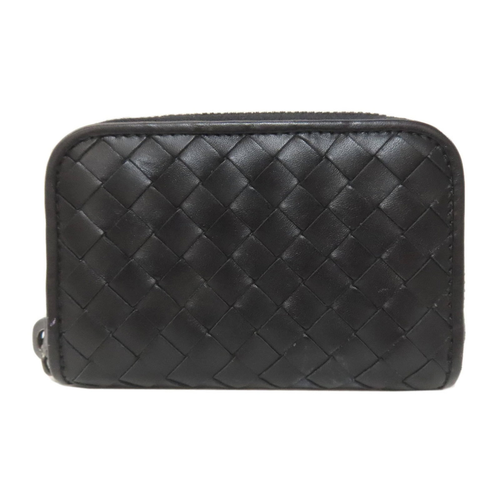 Bottega Veneta Coin Purse/ Coin Case Leather: Bottega Veneta Coin Purse/ Coin Case Leather The Bottega Veneta Coin Purse features sleek, black leather construction with a sturdy zipper closure. Measuring 7.5cm x 11cm x 2.5cm, it offers ample spac