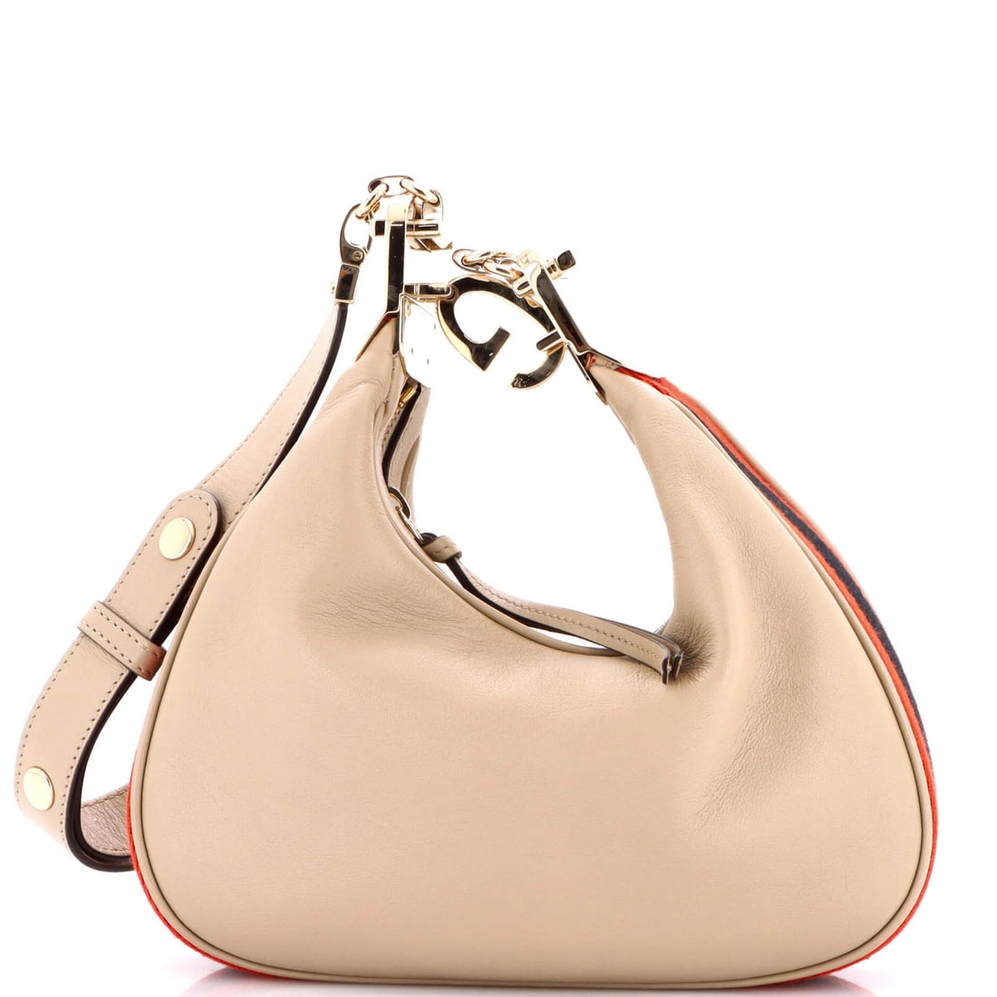 Small leather attache bag from Gucci: Small leather attache bag from Gucci Small Gucci leather attache bag with neutral exterior and gold tone hardware, featuring faux leather exterior and fabric interior. This cross body bag measures 5" 