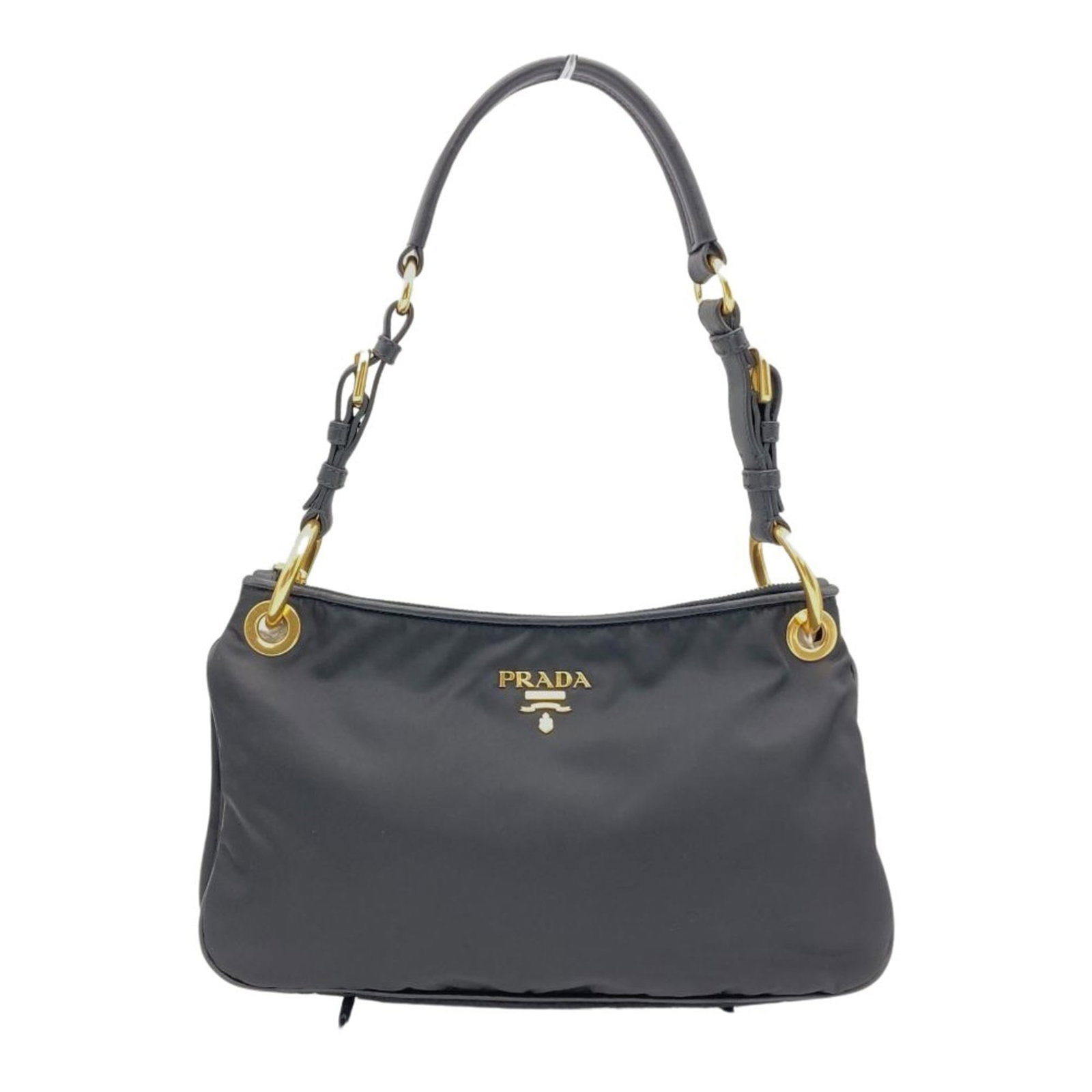 Shoulder Bag Nylon by Prada: Shoulder Bag Nylon by Prada Black Nylon Shoulder Bag by Prada, measuring 18cm x 32cm x 9cm, features a classic design with a few traces of usage visible. The bag's nylon material shows some scratches 