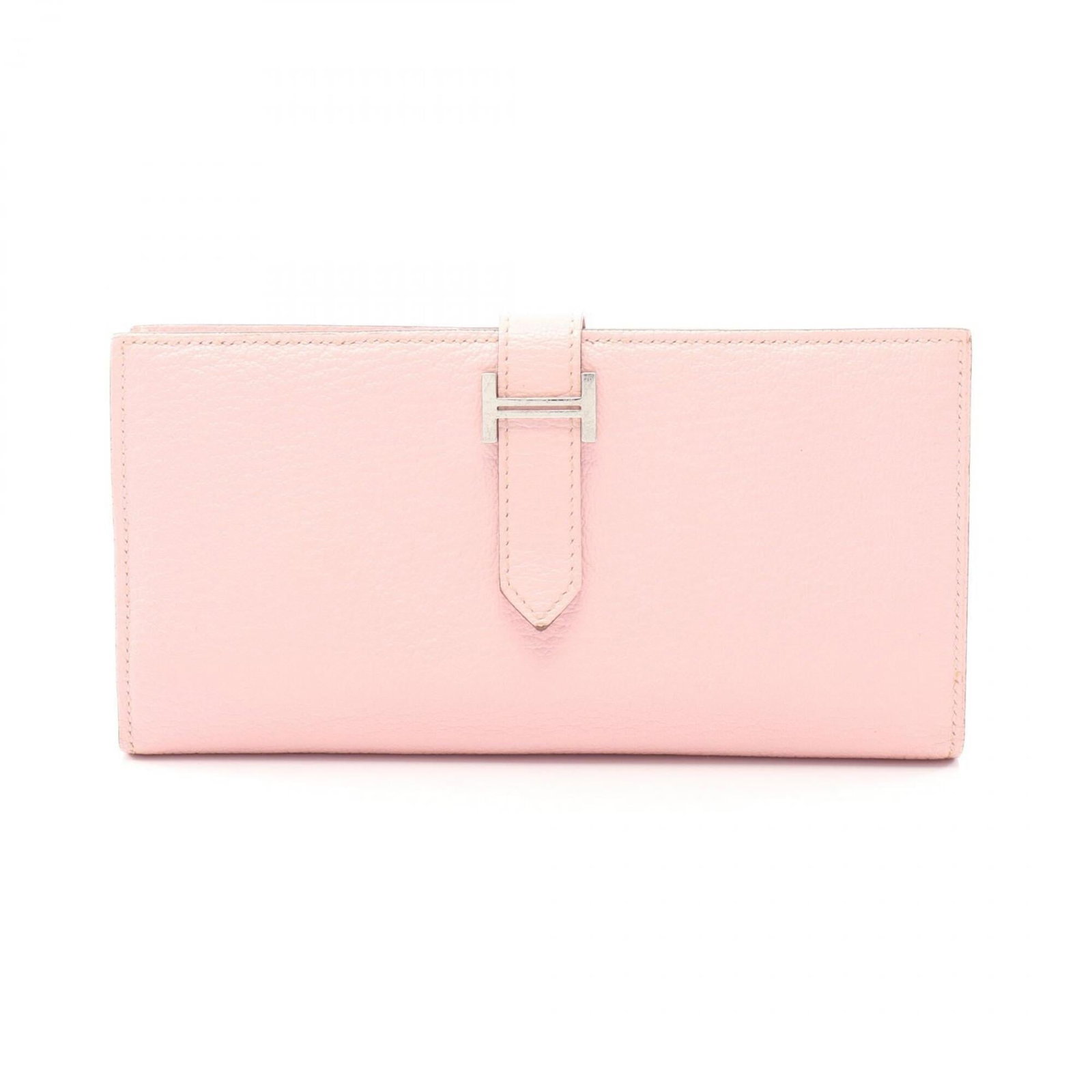 Chevre leather bi-fold wallet by Hermes: Chevre leather bi-fold wallet by Hermes Chevre leather bi-fold wallet by Hermes features a soft pink, Rose Sakura hue. Made from high-quality chevre leather, this long wallet boasts a classic design