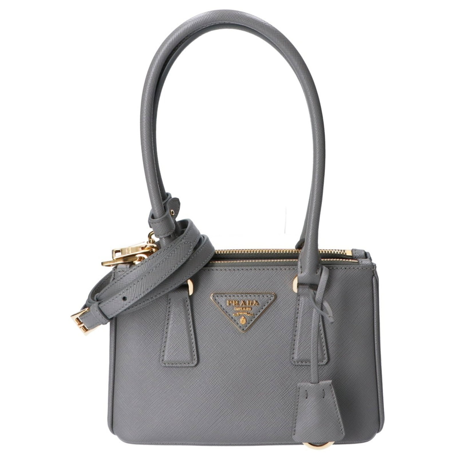 Handbag Leather by Prada: Handbag Leather by Prada Saffiano leather handbag from Prada, featuring a classic design with clean lines and a timeless aesthetic. Made in mint condition, like new item with minimal signs of wear. Th