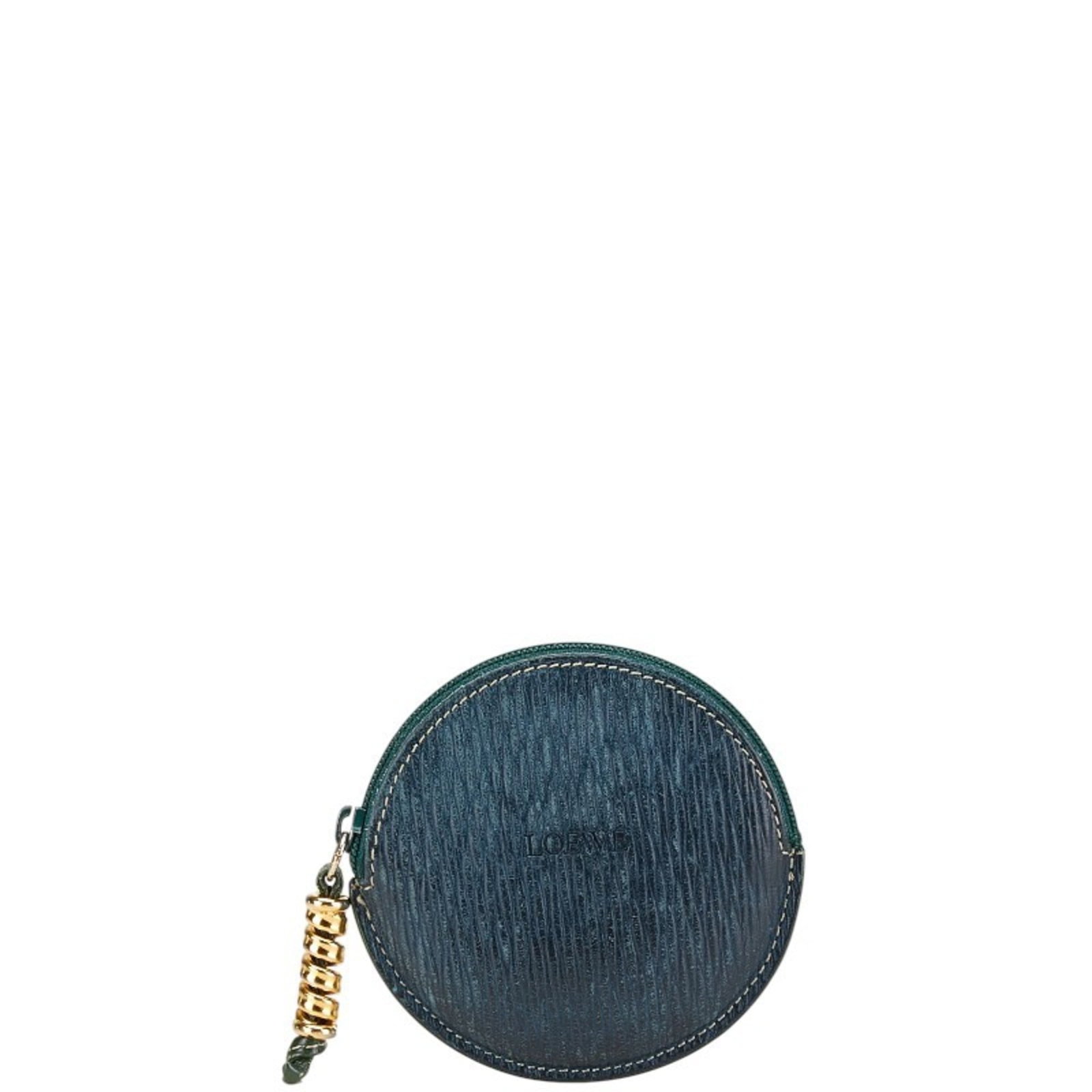 Loewe Coin Purse/ Coin Case Leather: Loewe Coin Purse/ Coin Case Leather This Loewe coin purse features a vibrant green leather exterior, measuring 9cm x 9.5cm x 3.00mm. With its classic design and subtle scratches from use, it