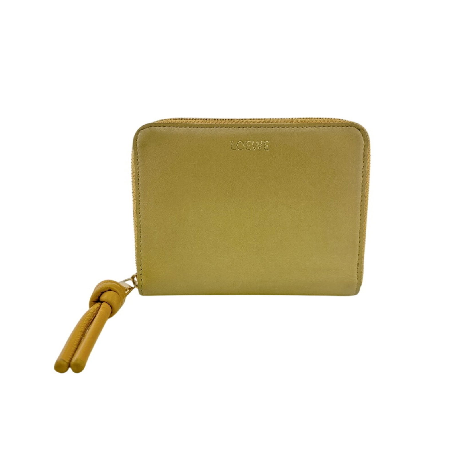 Loewe Wallet (Bi-Fold) Leather: Loewe Wallet (Bi-Fold) Leather This Loewe bi-fold leather wallet features a bright and sunny yellow color, adding a pop of personality to any daily carry. With its classic design and sturdy