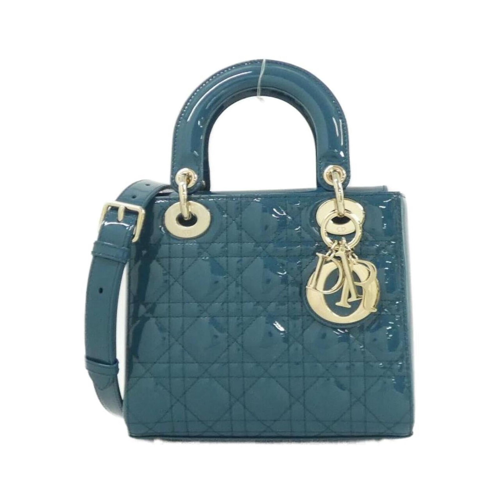 Christian Dior Handbag Leather: Christian Dior Handbag Leather Blue leather Christian Dior handbag with enamel details, measuring 17cm x 20cm x 8cm. The bag shows some scratches and dirt from previous use but remains in very good