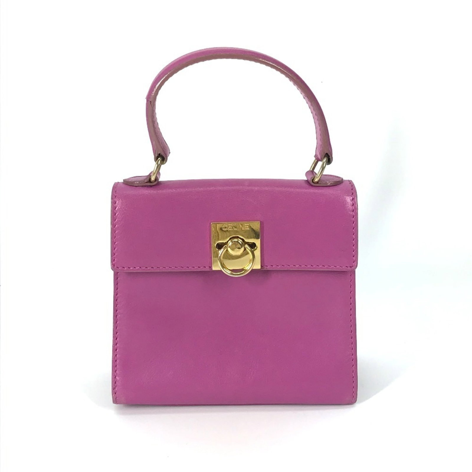 Handbag Leather by Celine: Handbag Leather by Celine Used Celine Handbag in Purple Leather, 11.5cm x 13cm x 5.5cm. This handbag features a rich purple leather exterior with traces of usage and minor scratches/dirt. The