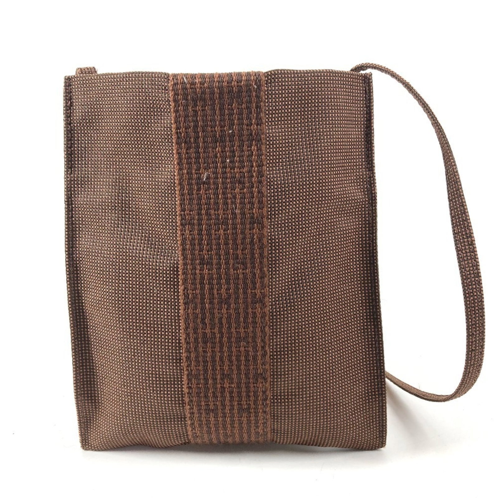 Shoulder bag canvas pochette hermes handbag: Shoulder bag canvas pochette hermes handbag Brown canvas shoulder bag with a classic pochette design, featuring a timeless and understated style. This pre-owned handbag is in very good condition,