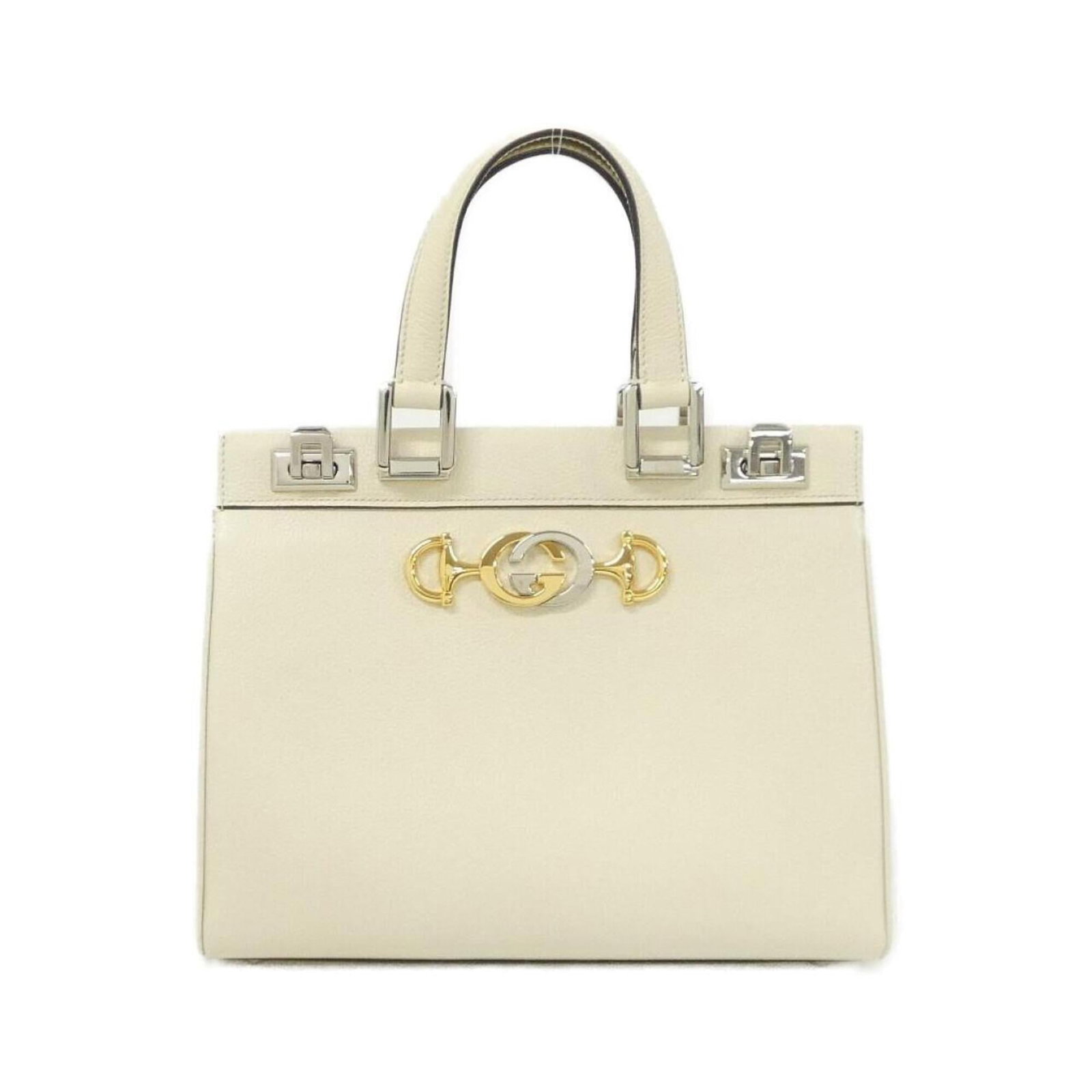Handbag Leather Gucci: Handbag Leather Gucci Off-white Gucci leather handbag with gold and silver hardware, featuring a classic design. The bag has some scratches and dirt from previous use, but remains in very good