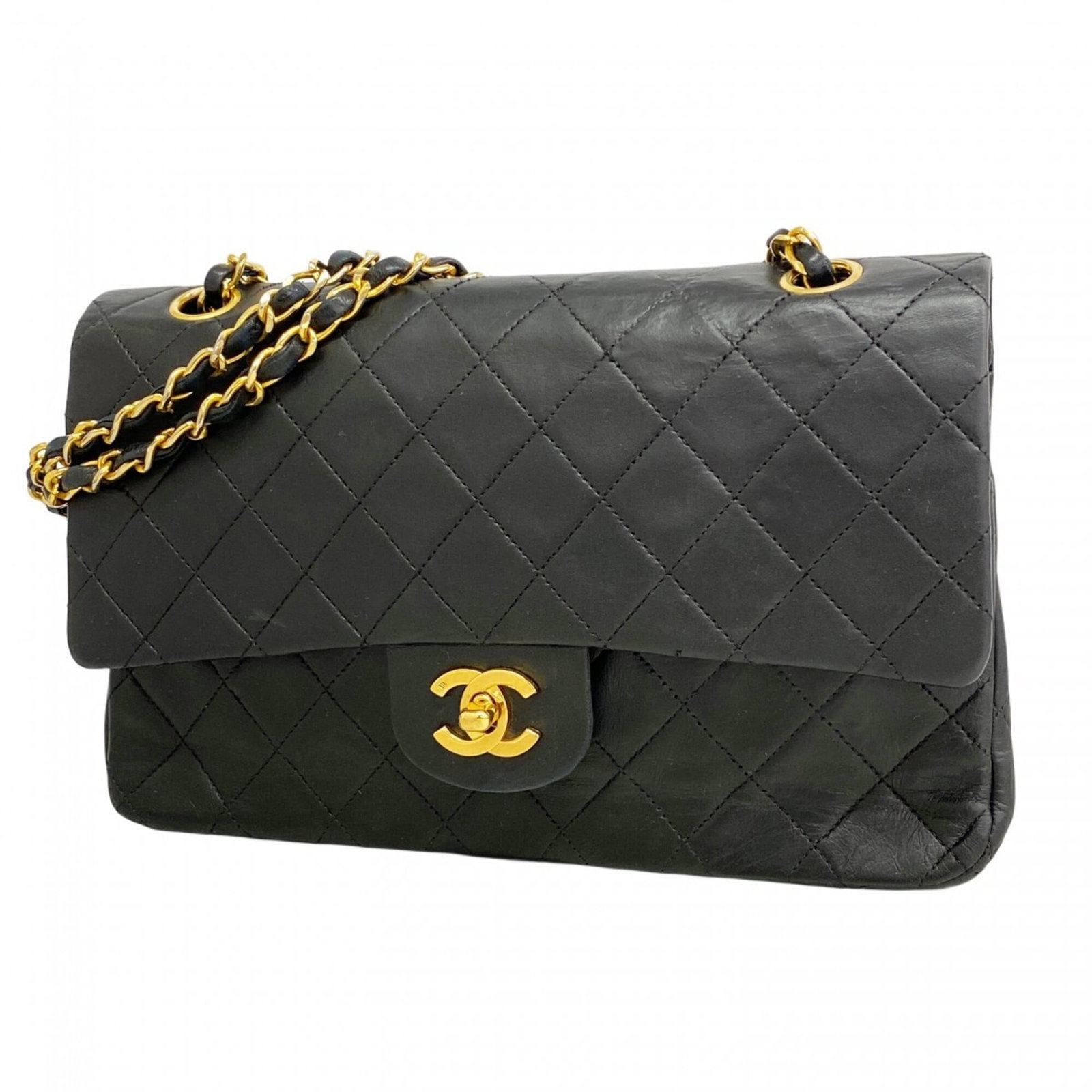 Shoulder bag leather Chanel: Shoulder bag leather Chanel This black lambskin shoulder bag features gold hardware and is made from high-quality leather. With its classic design, it has a timeless appeal that remains popular among