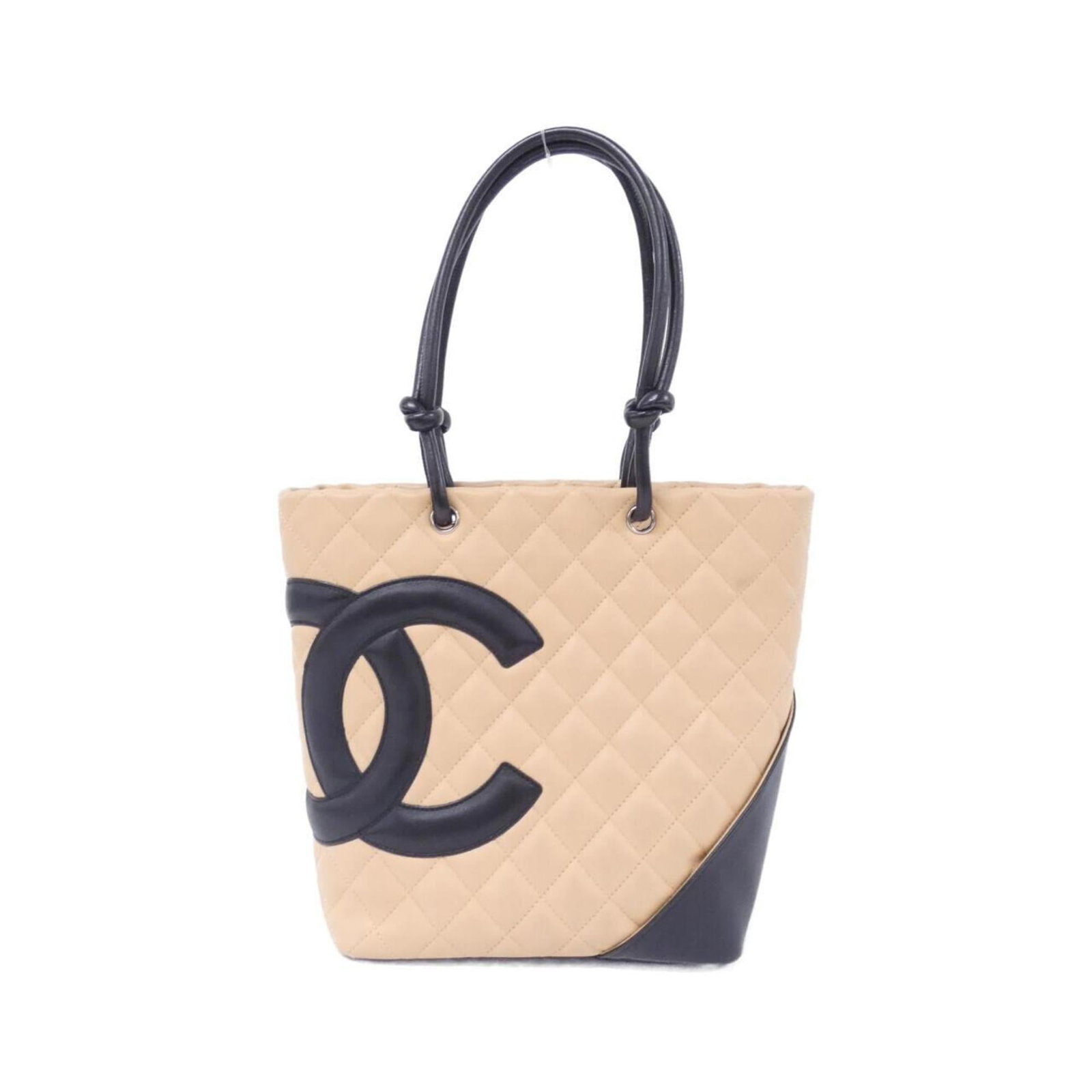 Chanel Handbag Leather: Chanel Handbag Leather Calfskin leather construction gives this Chanel handbag its distinctive look and feel. The beige and black color combination adds a touch of sophistication, while the silver har