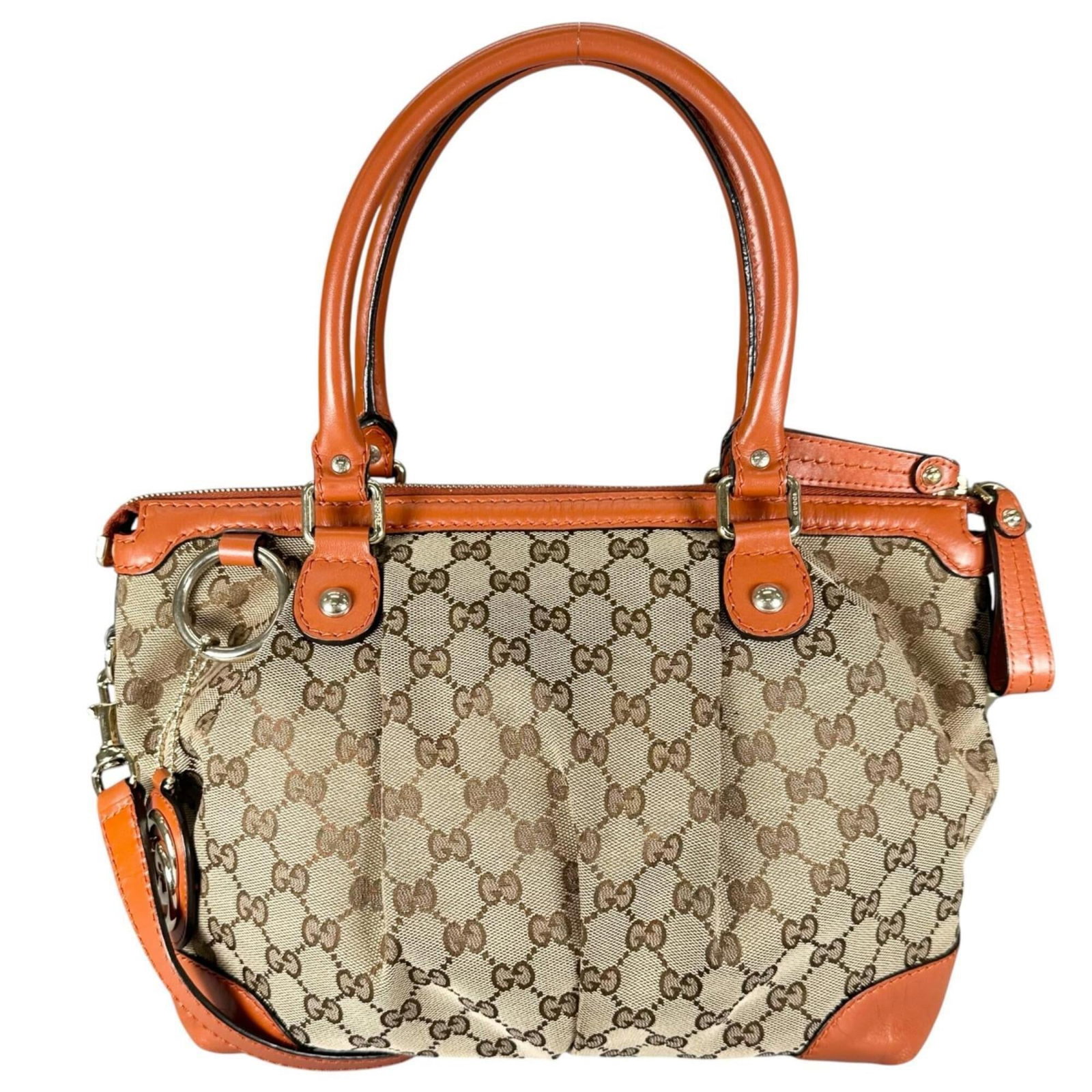 Gucci Handbag Gg Canvas: Gucci Handbag Gg Canvas Gucci Handbag Gg Canvas in Beige and Orange, featuring gold hardware. This versatile handbag boasts a spacious interior with adjustable straps that can be worn in multiple