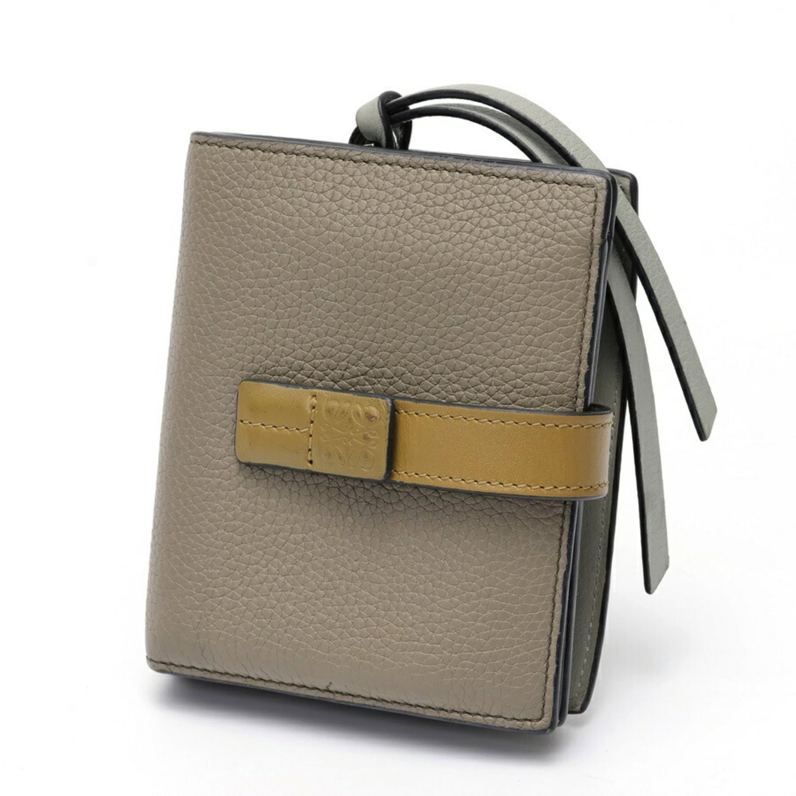 Loewe Wallet (Bi-Fold) Leather: Loewe Wallet (Bi-Fold) Leather Used Loewe Bi-Fold Leather Wallet in Beige and Khaki. This classic wallet features high-quality calfskin leather, with visible scratches and dirt from previous use.