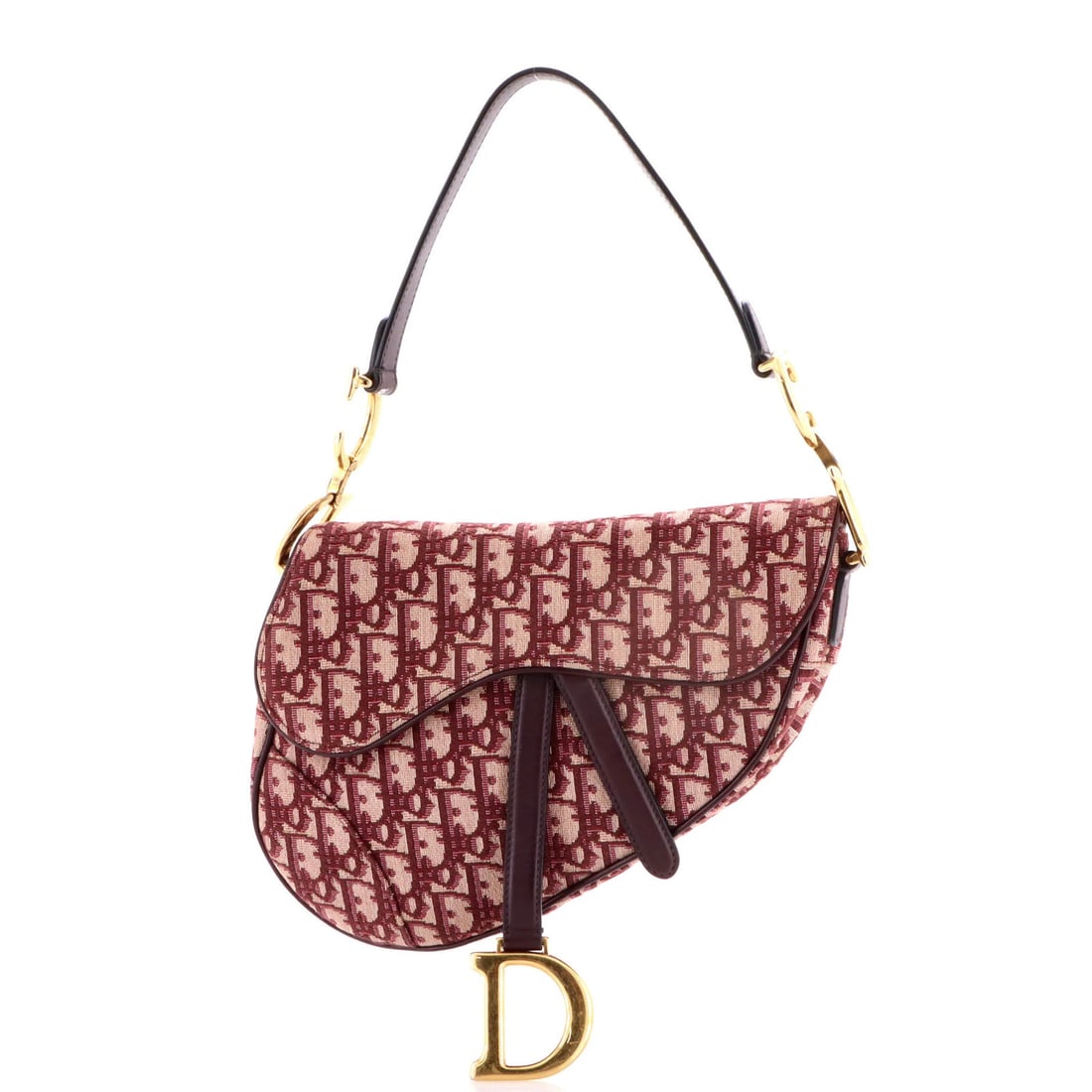 Canvas handbag saddle medium oblique Christian Dior: Canvas handbag saddle medium oblique Christian Dior Canvas handbag saddle medium oblique Christian Dior features a striking red canvas exterior with an oblique design, adding a touch of sophistication