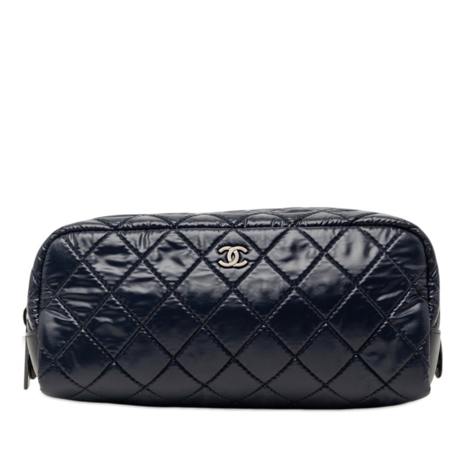 Nylon leather handbag pouch by Chanel: Nylon leather handbag pouch by Chanel Nylon leather handbag pouch by Chanel features a navy color and a compact size. Made from a combination of nylon and leather, this used item has some scratches an