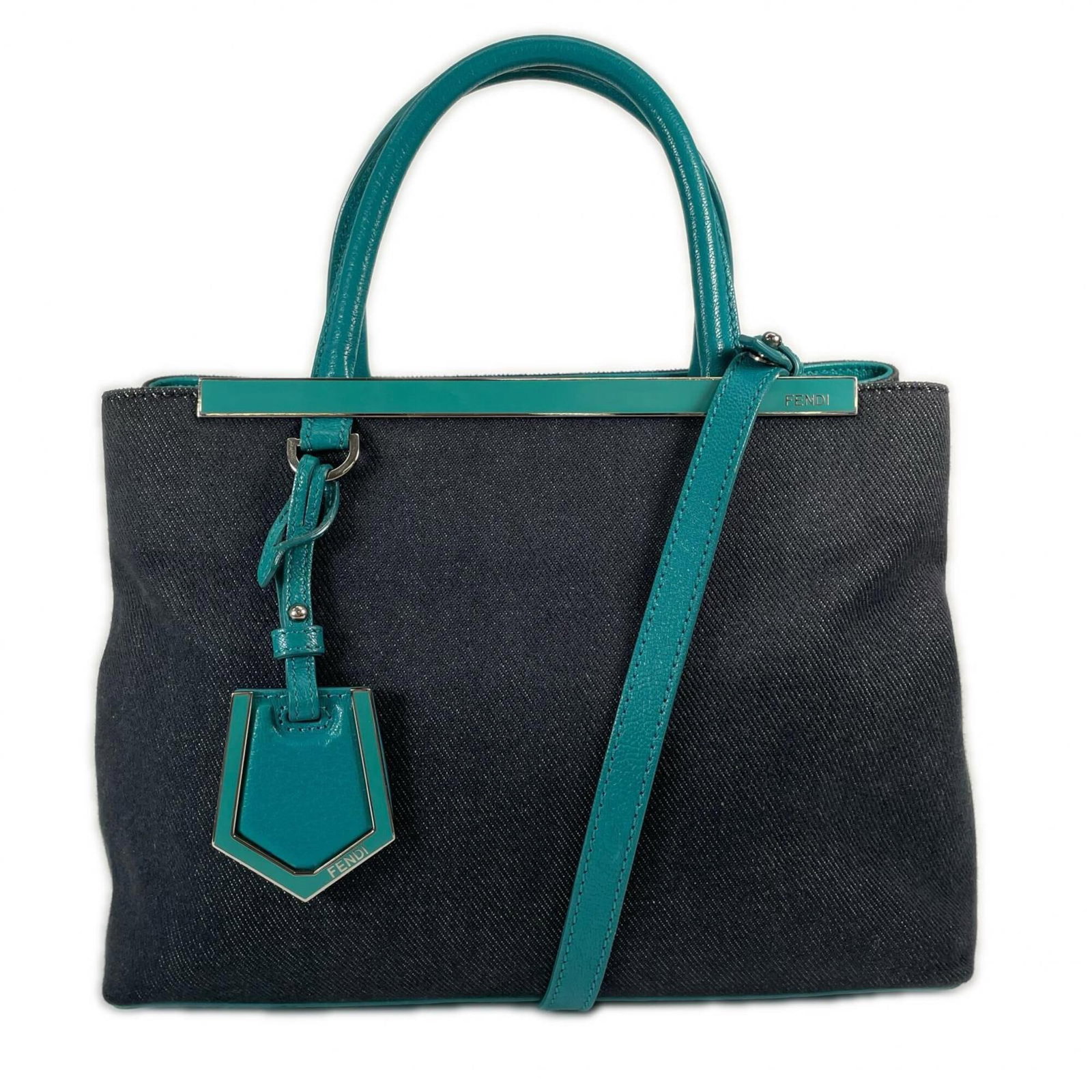 Handbag Leather by Fendi: Handbag Leather by Fendi This Fendi handbag features high-quality leather in a unique green and navy color combination, adorned with silver hardware. The bag measures 20cm x 26.5cm x 12.5cm and is mad