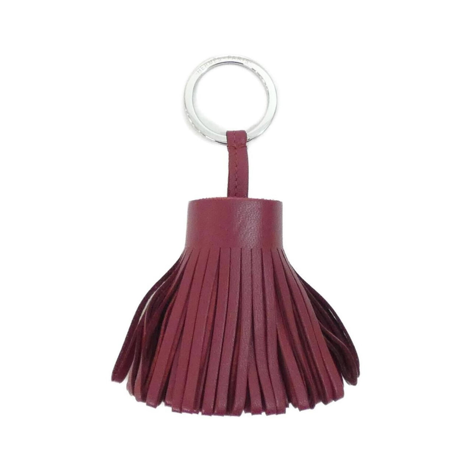 Agneau Keyring Hermes Milo: Agneau Keyring Hermes Milo Agneau Milo keyring from Hermes features a distinctive Rouge Grenat color. The item has some traces of usage, including minor scratches and dirt, but remains in very good