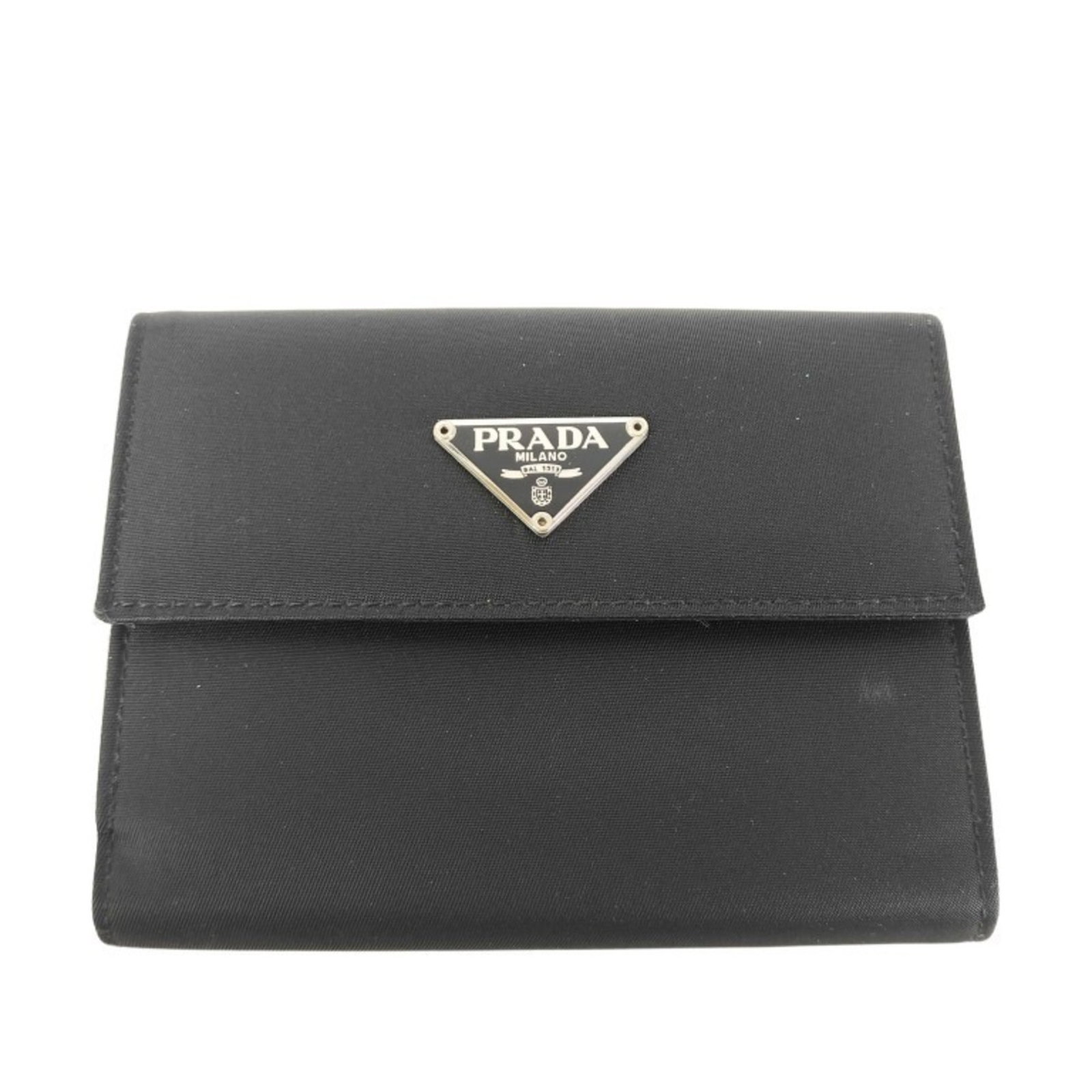 Nylon Bi Fold Wallet By: Nylon Bi Fold Wallet By Nylon bi-fold wallet by Prada, featuring a sleek black design with a durable nylon material. The compact size (9cm x 12cm x 2cm) makes it easy to carry, while the slight