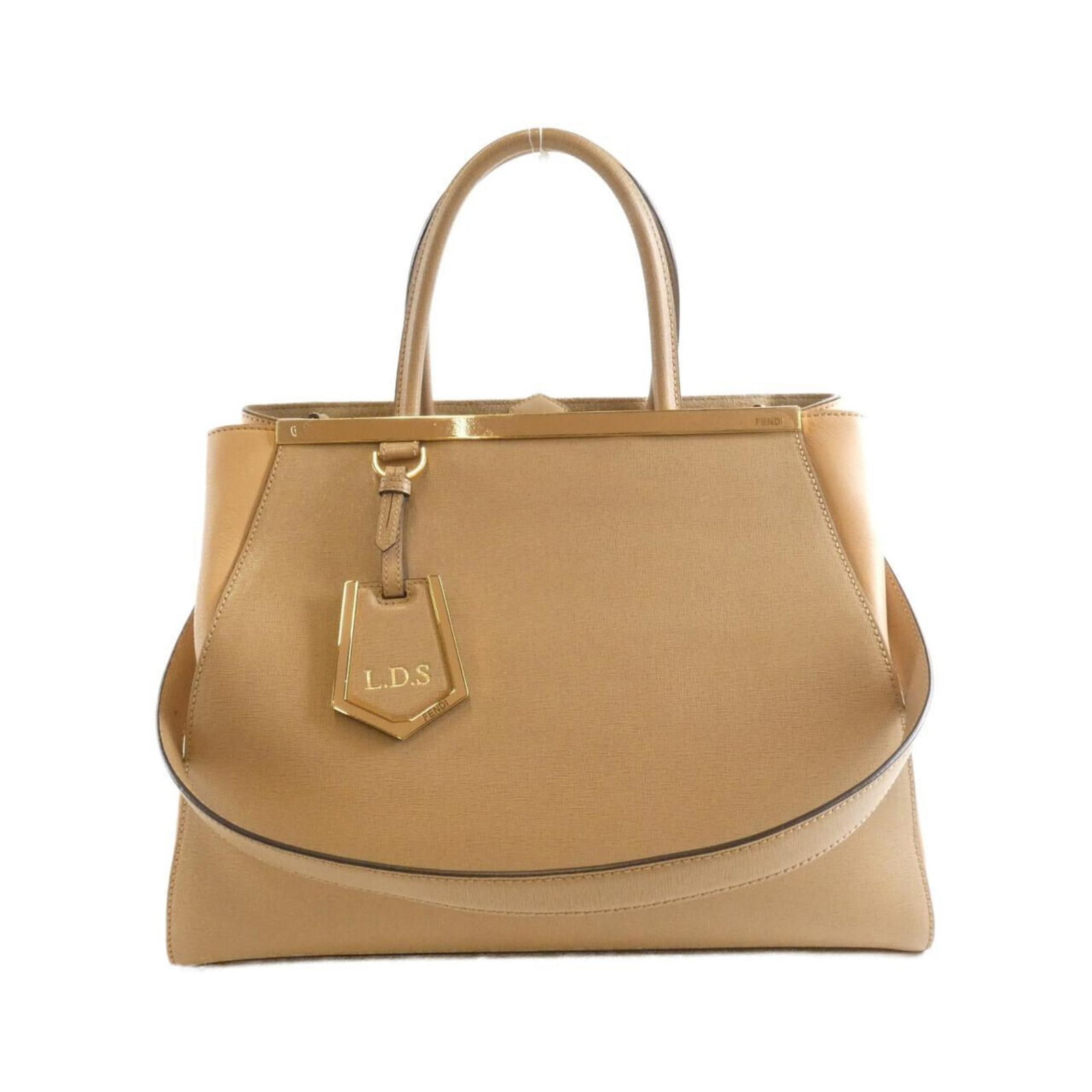 Handbag Leather by Fendi: Handbag Leather by Fendi Fendi's handbag features high-quality calfskin leather in a timeless beige color, adorned with gold hardware. The classic design boasts a spacious interior and sturdy