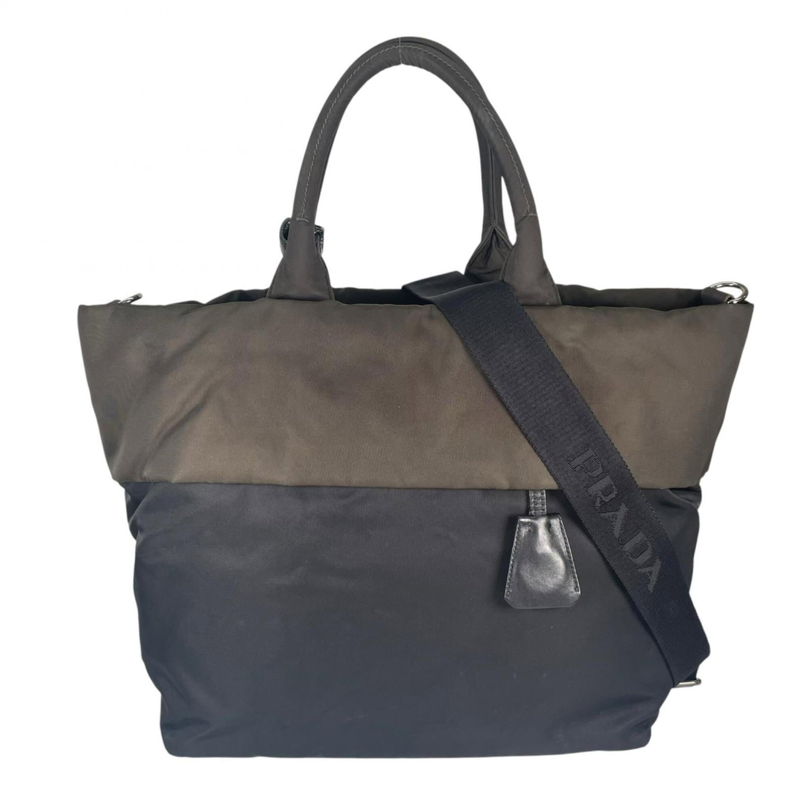 Shoulder Bag Nylon by Prada: Shoulder Bag Nylon by Prada Nylon shoulder bag from Prada, featuring a khaki color and silver hardware. The bag measures 30cm x 31cm x 17cm and has traces of usage with scratches and dirt visible. In 