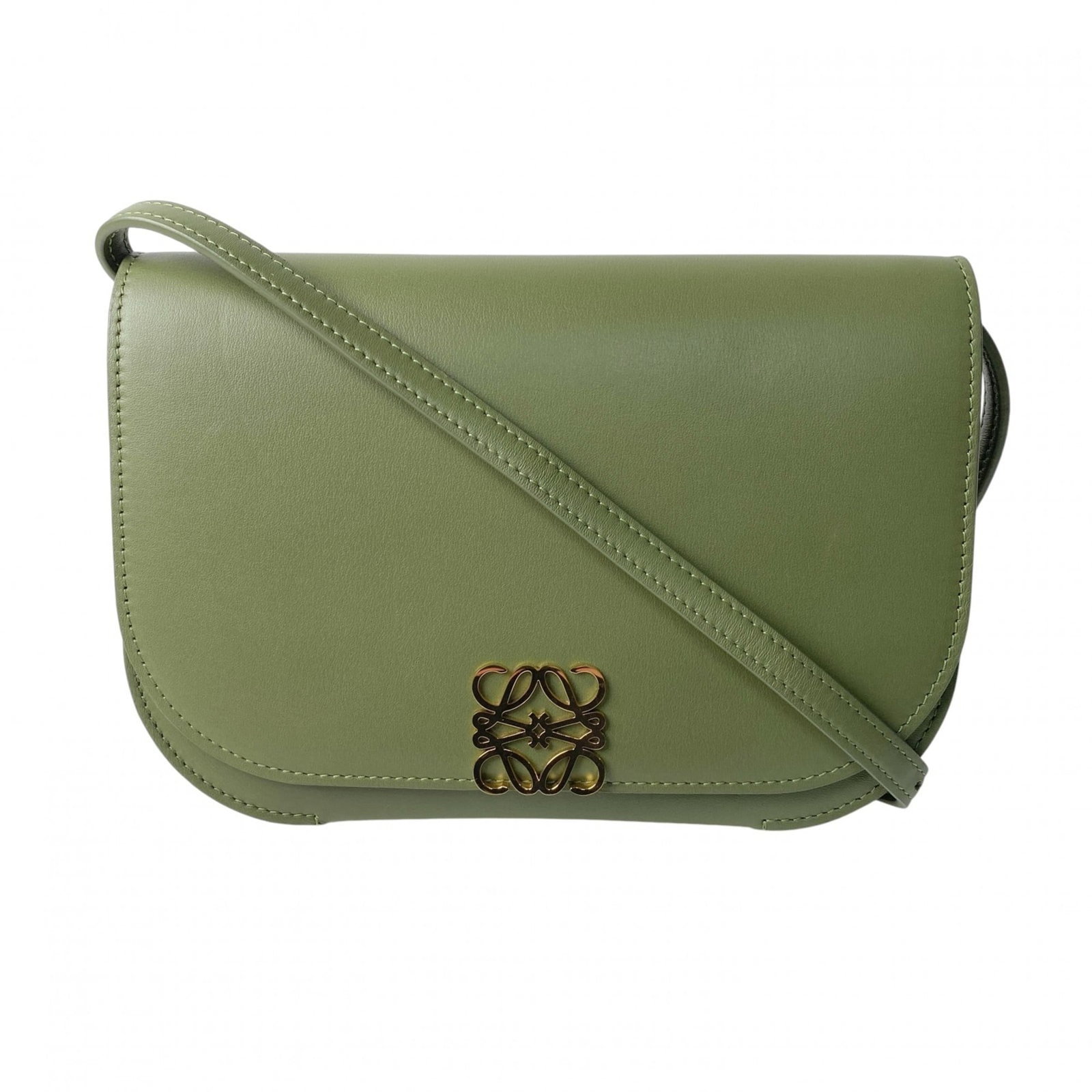 Shoulder Bag Leather Sling Loewe: Shoulder Bag Leather Sling Loewe This Loewe leather shoulder bag features a sleek green design with a classic sling style. Made from high-quality leather, it has a few traces of usage and some minor s