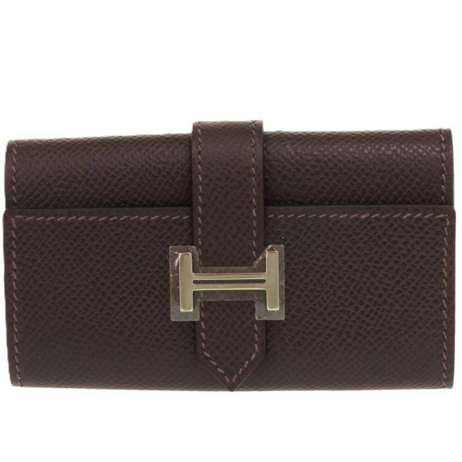 Epsom Leather Hermes Keycase: Epsom Leather Hermes Keycase Epsom Leather Hermes Keycase in Brown. This high-quality keycase features Epsom leather construction, a classic design, and a rich brown color. In near-perfect condition,
