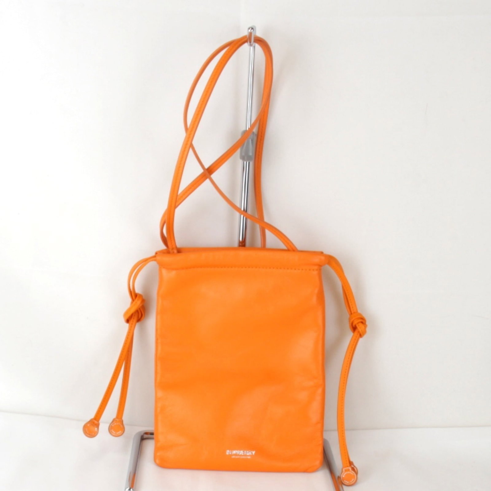 Burberry Shoulder Bag Leather: Burberry Shoulder Bag Leather Burberry Shoulder Bag Leather in vibrant orange, featuring a classic design with a 105cm strap length. Made from high-quality leather, this shoulder bag showcases a few