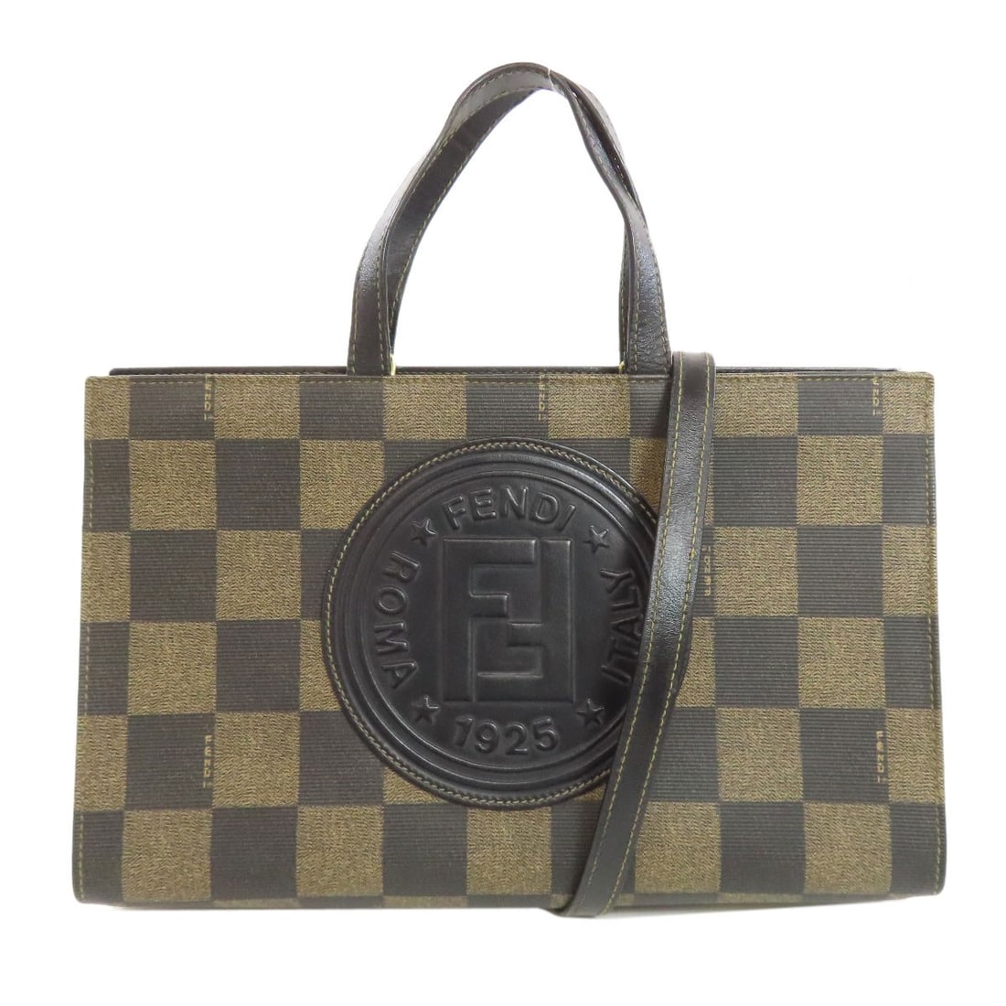 Handbag Pvc Checkered Fendi 2way: Handbag Pvc Checkered Fendi 2way Brown PVC checkered Fendi handbag with 2-way design. Made from high-quality PVC exterior, this unique handbag showcases a distinctive checkered pattern. The brown colo