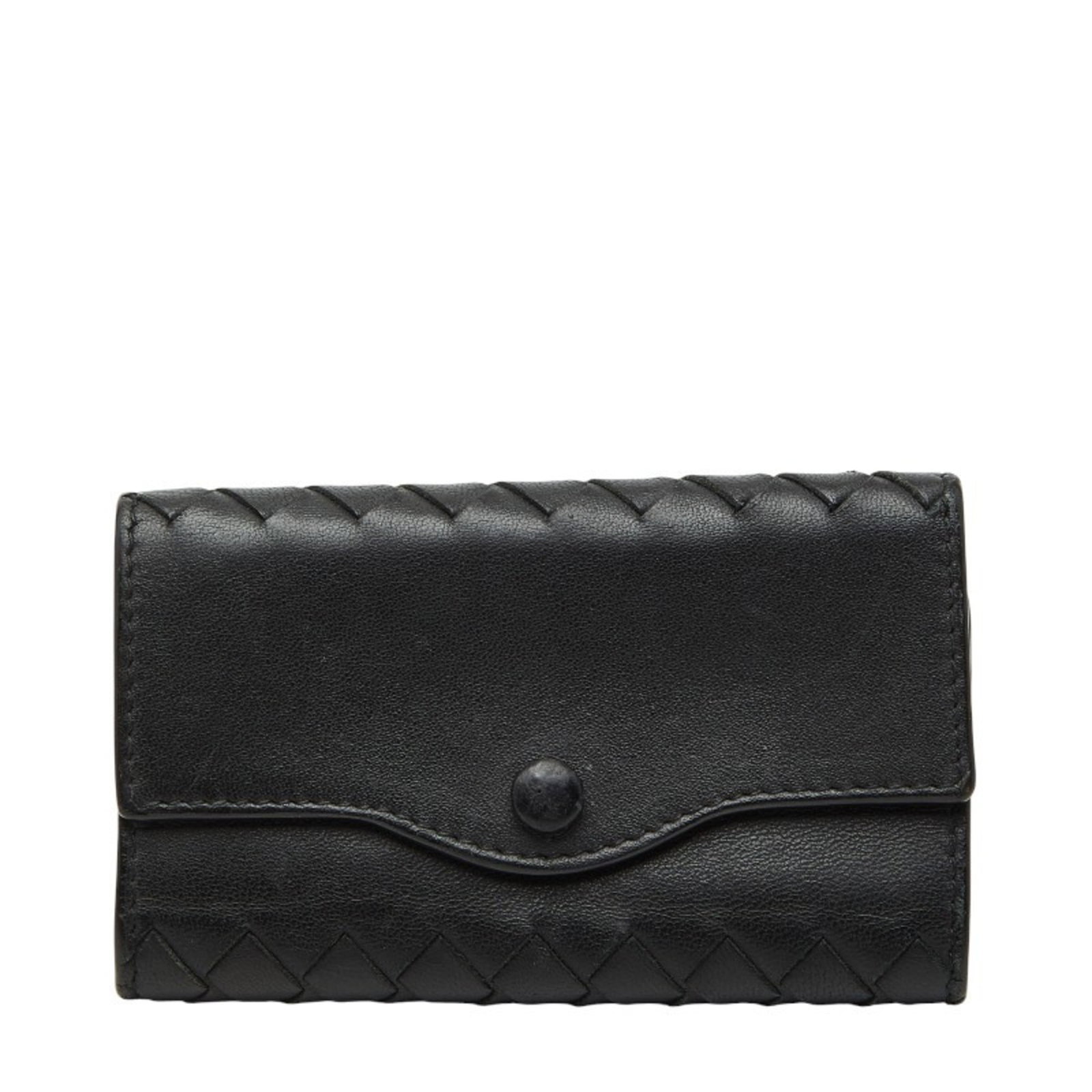 Keycase Leather by Bottega Veneta: Keycase Leather by Bottega Veneta Keycase Leather by Bottega Veneta in black leather, with traces of usage and minor scratches, offers a stylish accessory for everyday carry. Made from high-quality