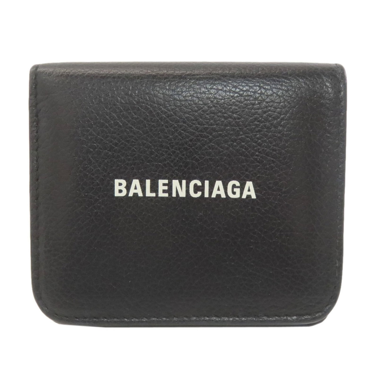 Balenciaga Wallet (Bi-Fold) Leather: Balenciaga Wallet (Bi-Fold) Leather Black calfskin bi-fold wallet from Balenciaga, with traces of usage and minor scratches. The leather has been well-worn, giving it a subtle patina. A classic