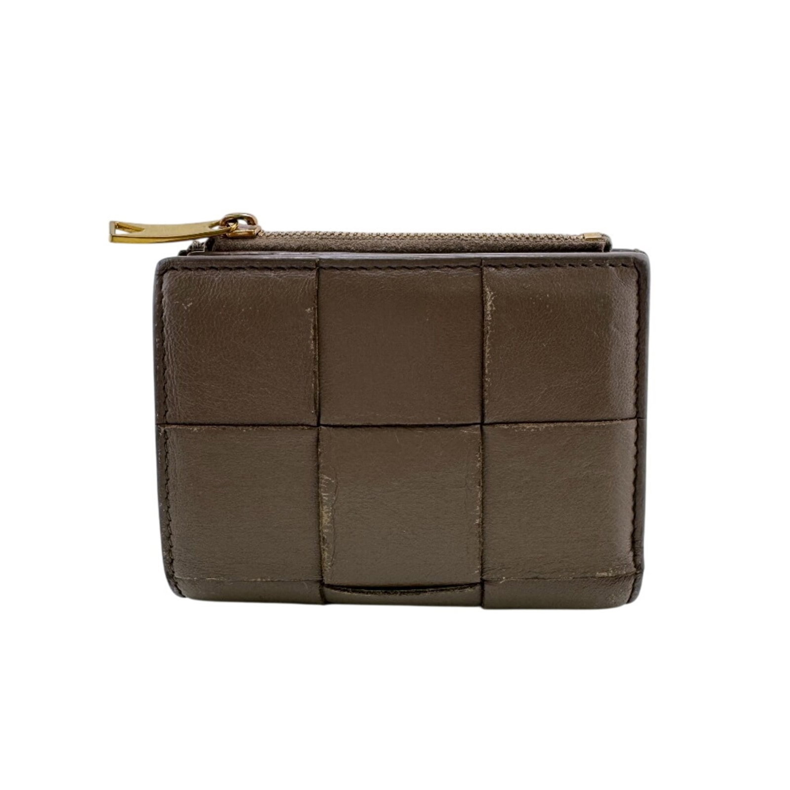 Bottega Veneta Wallet (Bi-Fold) Leather: Bottega Veneta Wallet (Bi-Fold) Leather Brown Bottega Veneta Bi-Fold Leather Wallet. This used wallet features brown leather and measures 9cm x 11.5cm, with traces of usage visible. It has scratches
